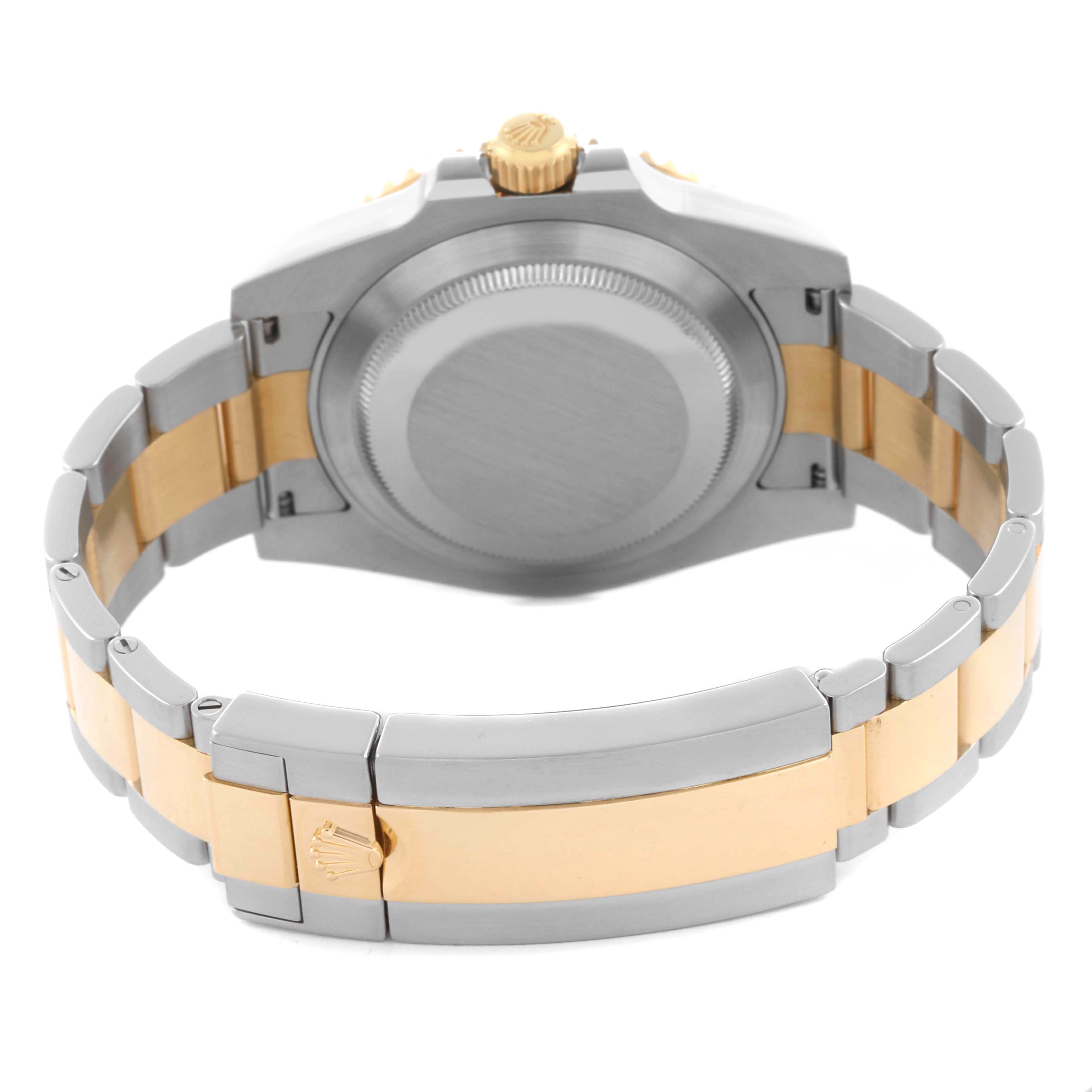 The image shows the back and bracelet clasp of a Rolex Submariner 116613 Men's Steel and Gold (two tone) Blue Dial 116613 Men's Steel and Gold (two tone) Blue Dial, highlighting its two-tone metal design.