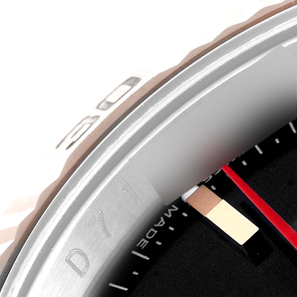 The image shows a close-up angle of the bezel and part of the dial of a Rolex Turn-o-Graph 116261 Men's Steel and Gold (two tone) Black Dial 116261 Men's Steel and Gold (two tone) Black Dial watch.