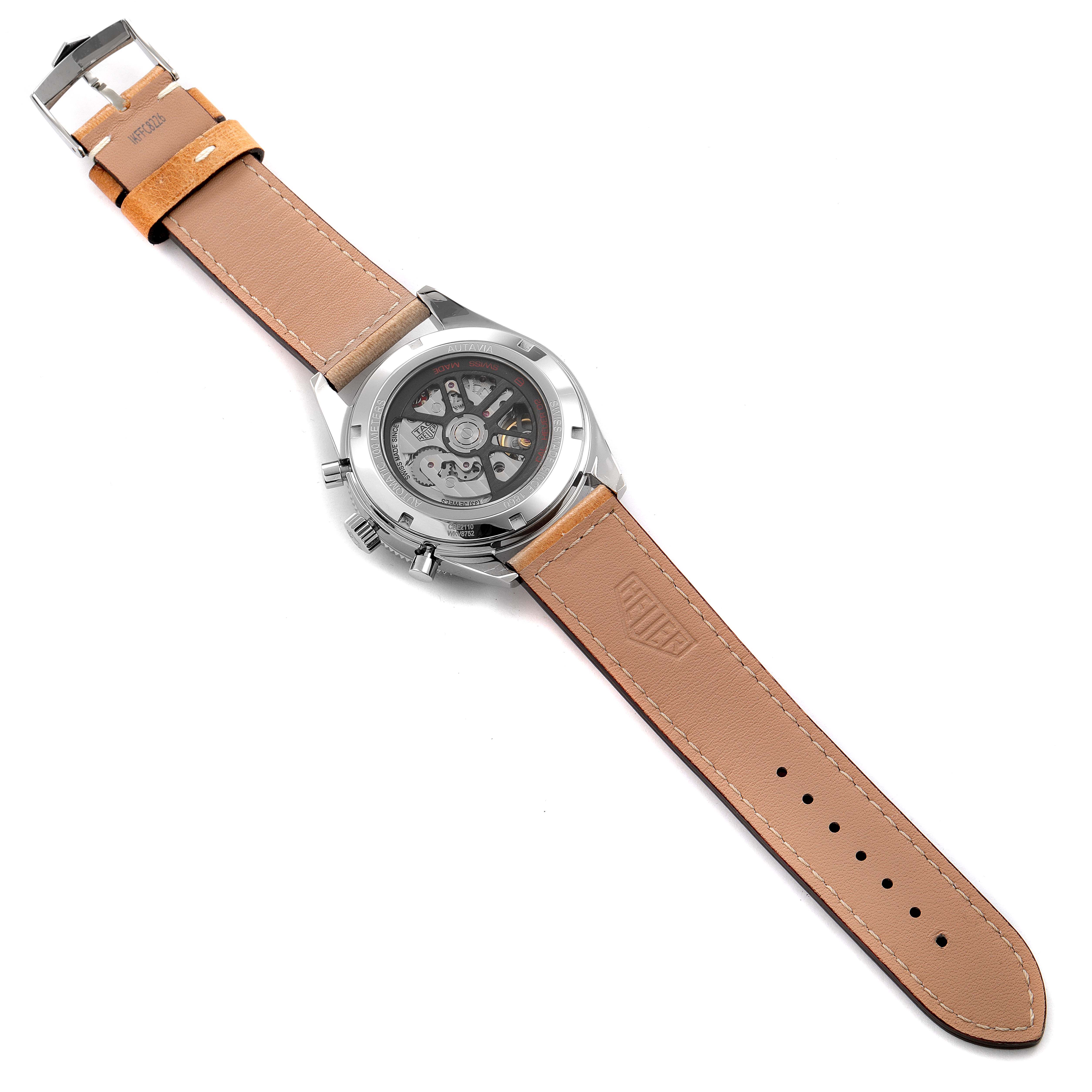 This image shows the back of an Autavia model by Tag Heuer, displaying the internal mechanism and tan leather strap.