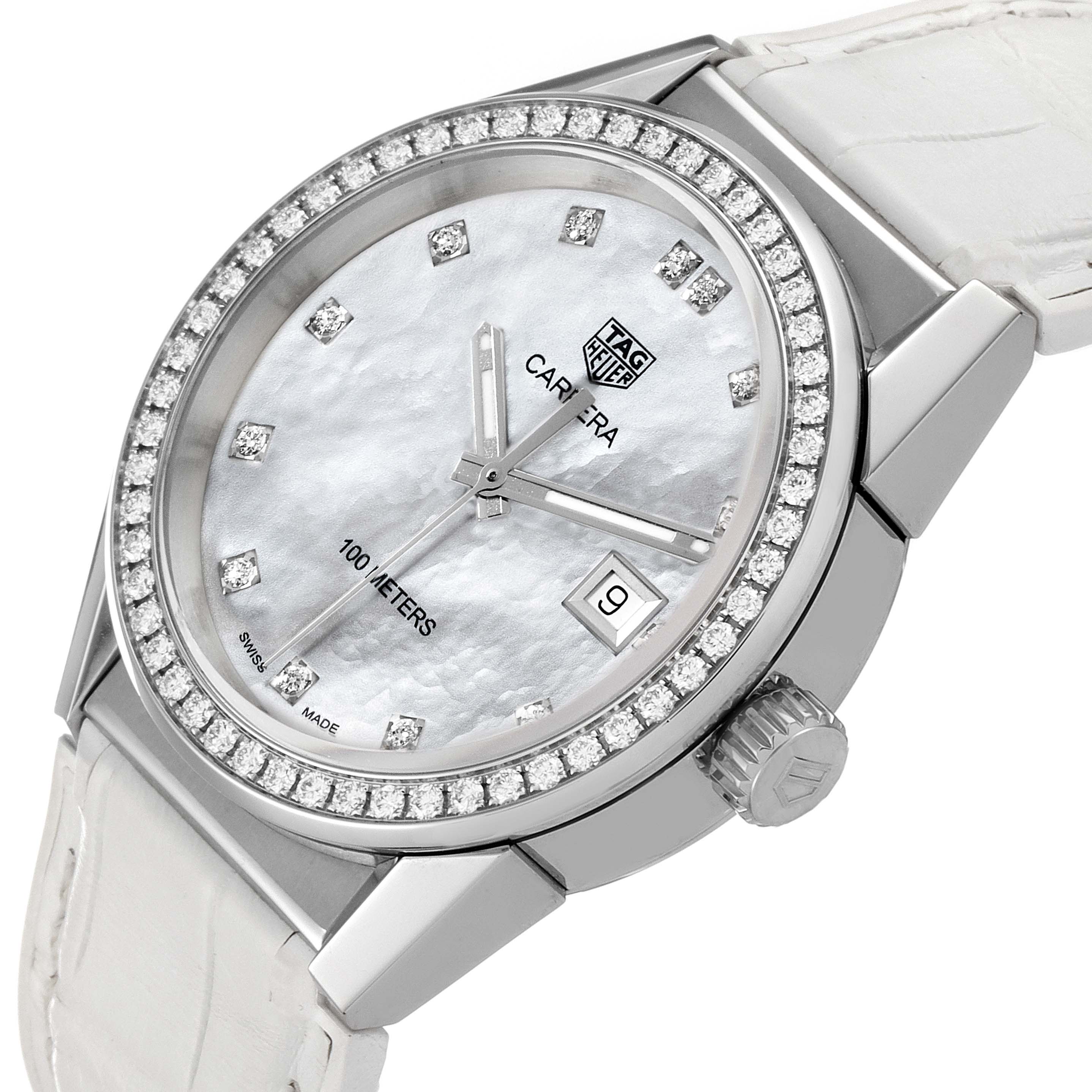 The image shows a close-up angle of the face and bezel of the Tag Heuer Carrera WBG1315.BA0758 Women's Stainless Steel Mother of Pearl Dial WBG1315.BA0758 Women's Stainless Steel Mother of Pearl Dial watch, featuring a diamond-studded bezel and a white strap.