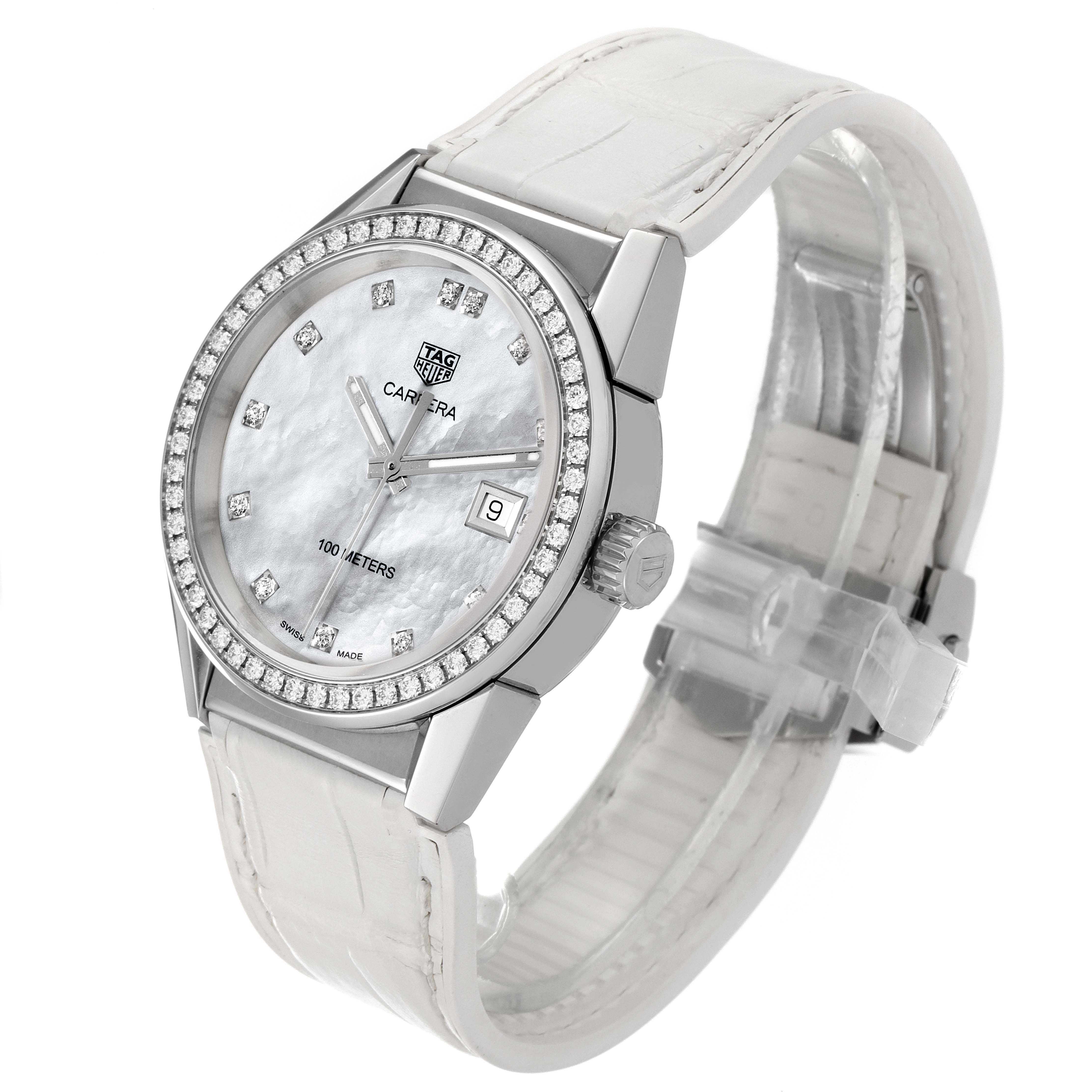 The image shows a Tag Heuer Carrera WBG1315.BA0758 Women's Stainless Steel Mother of Pearl Dial WBG1315.BA0758 Women's Stainless Steel Mother of Pearl Dial watch at an angle, highlighting its face, bezel, and strap.