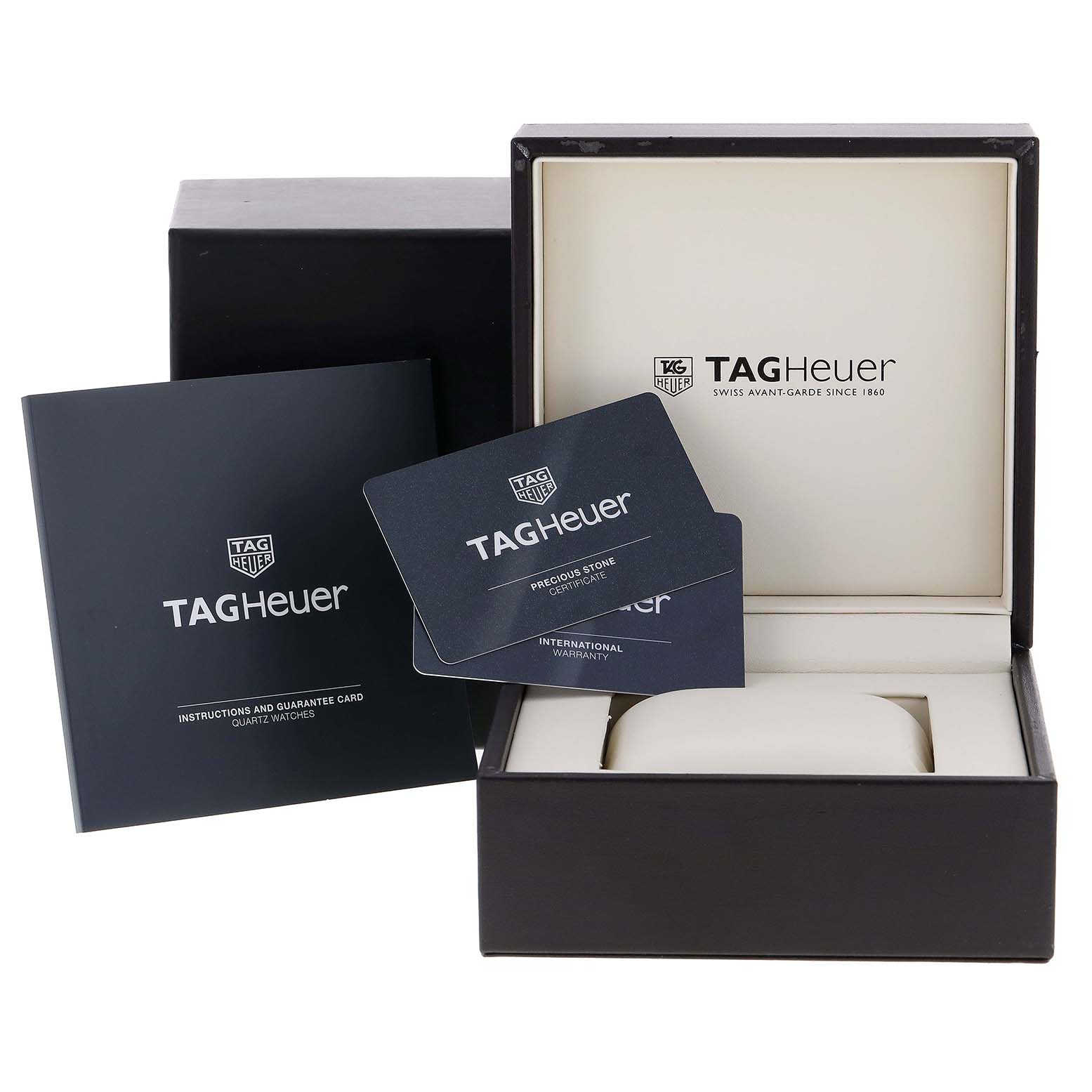 This image shows the packaging, instruction manual, and warranty cards for a Tag Heuer Carrera WBG1315.BA0758 Women's Stainless Steel Mother of Pearl Dial WBG1315.BA0758 Women's Stainless Steel Mother of Pearl Dial watch.