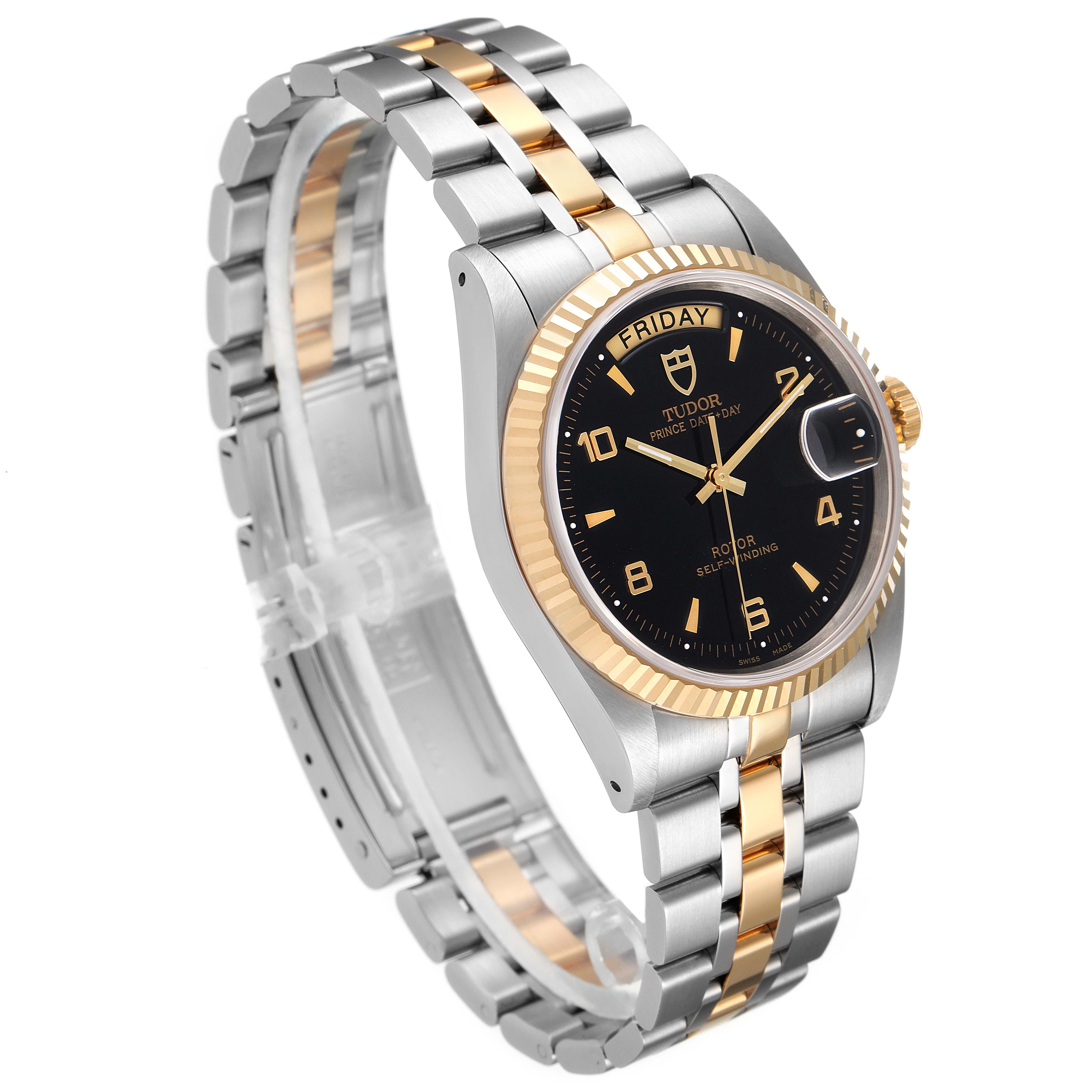 This Tudor Prince 76213 Men's Steel and Gold (two tone) Black Dial 76213 Men's Steel and Gold (two tone) Black Dial watch is shown at a slight angle, highlighting its black dial, two-tone bracelet, and fluted bezel.