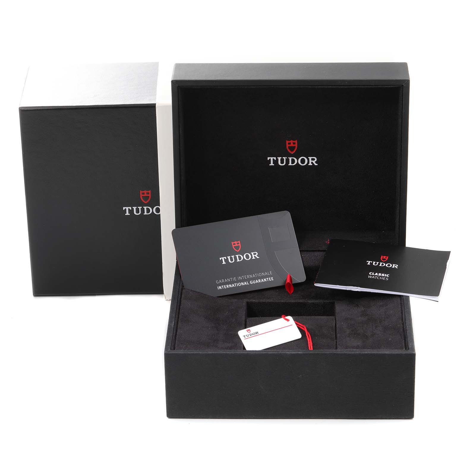 This image shows the packaging and accessories for a Tudor Prince 76213 Men's Steel and Gold (two tone) Black Dial 76213 Men's Steel and Gold (two tone) Black Dial watch, including a certificate and instruction booklet.