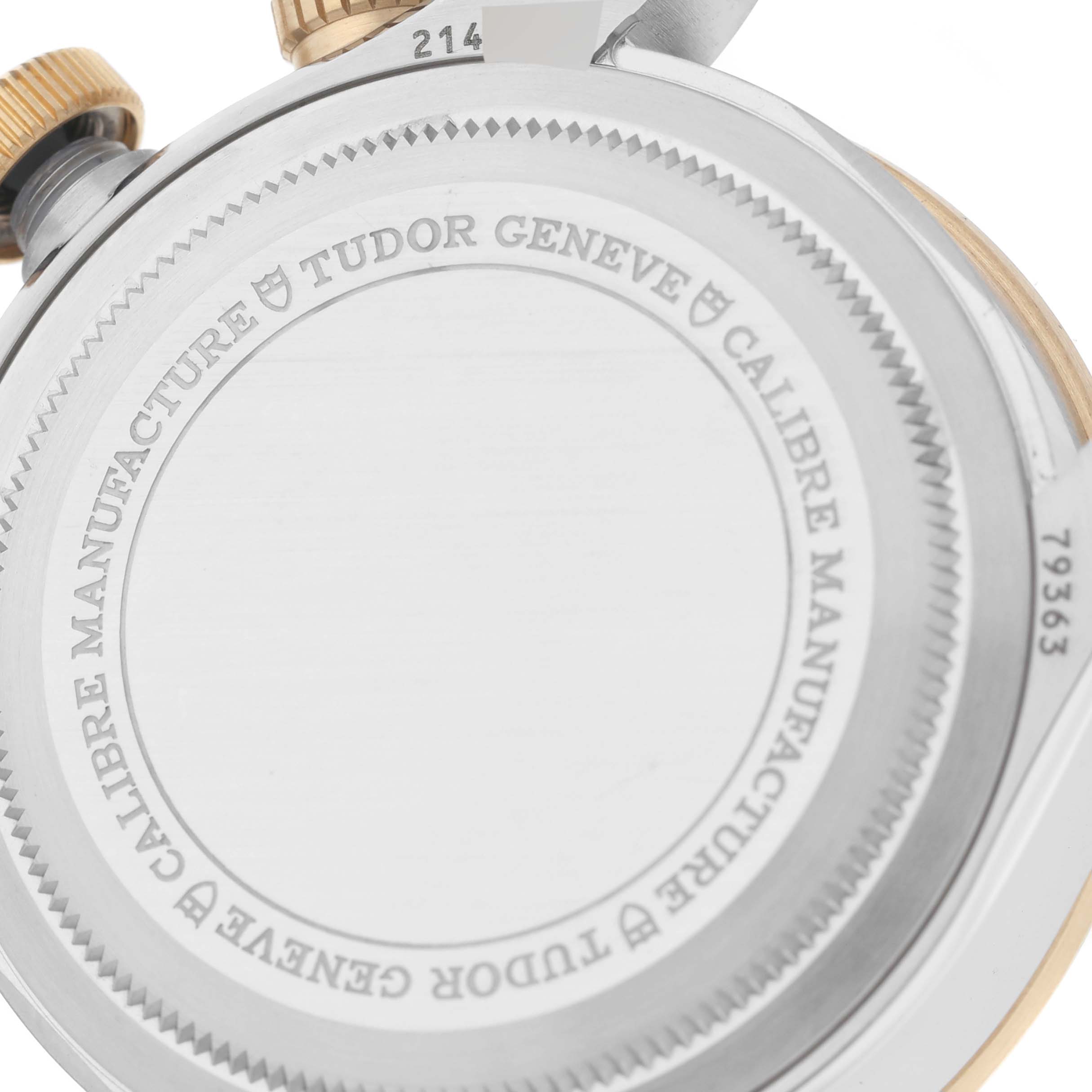 The image shows the case back and crown of the Tudor Heritage Black Bay 79363 Men's Steel and Gold (two tone) Champagne Dial 79363 Men's Steel and Gold (two tone) Champagne Dial watch, focusing on the engraved details.