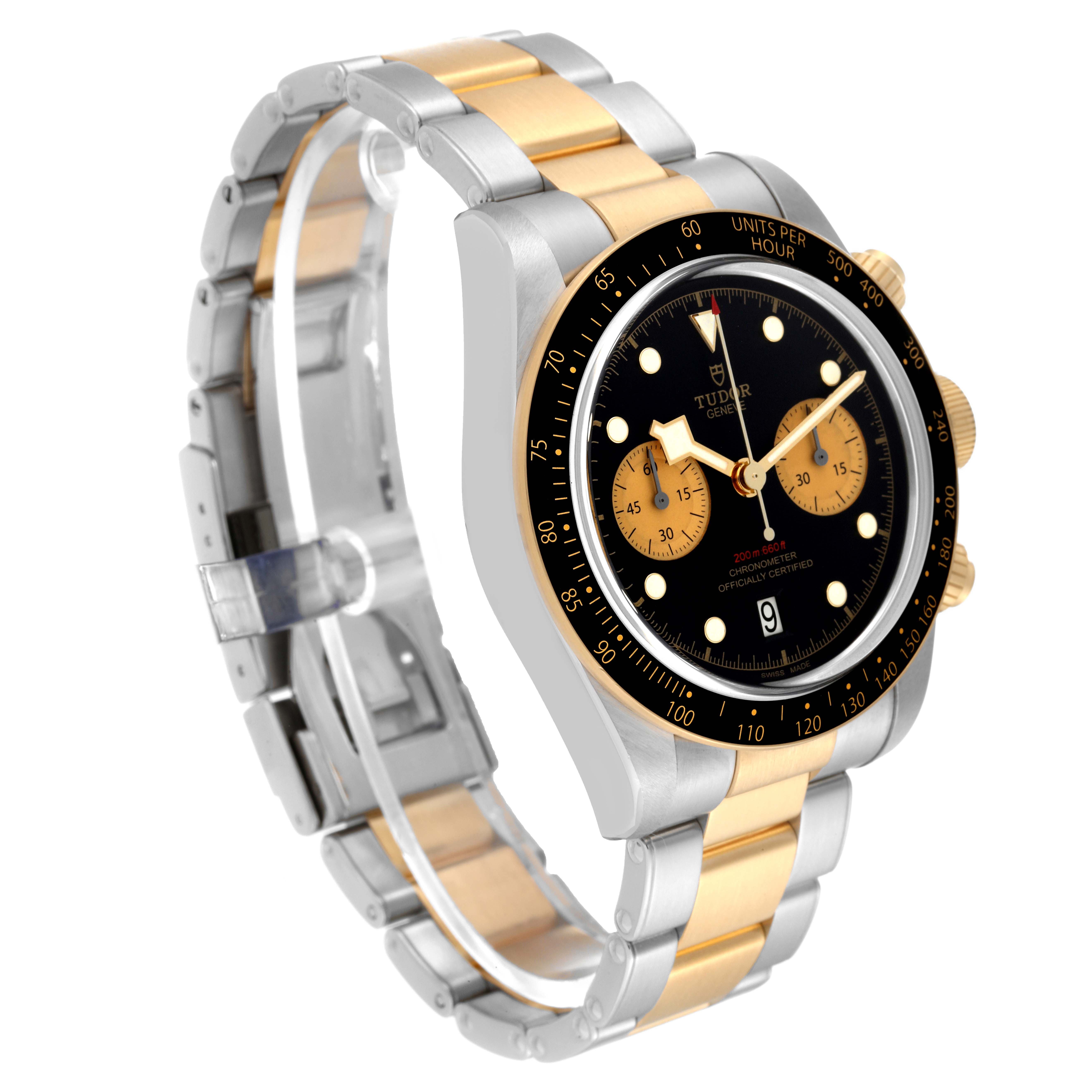The image shows a Tudor Heritage Black Bay 79363N Men
s Steel and Gold (two tone) Black Dial 79363N Men
s Steel and Gold (two tone) Black Dial watch with a side angle, displaying the two-tone bracelet, black dial, and chronograph features.