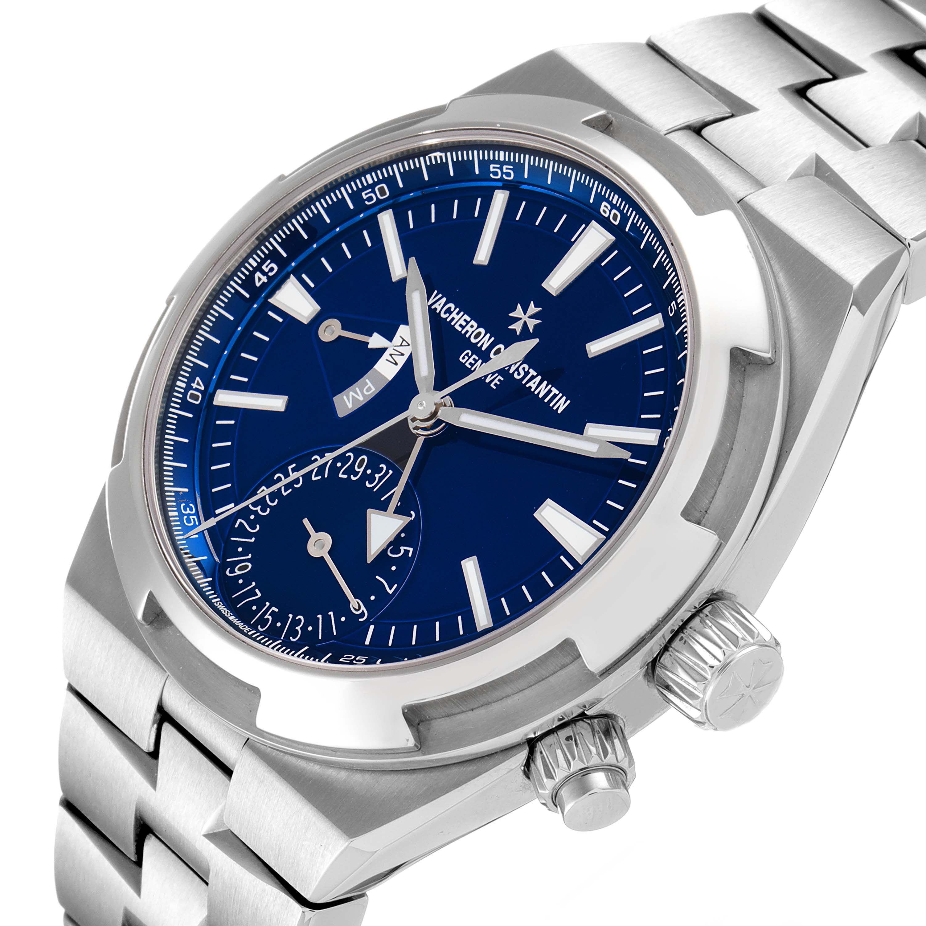 The image shows an angled close-up of the Vacheron Constantin Overseas 7900V/110A-B334 Men's Stainless Steel Blue Dial 7900V/110A-B334 Men's Stainless Steel Blue Dial watch, highlighting the dial, crown, and stainless steel bracelet.