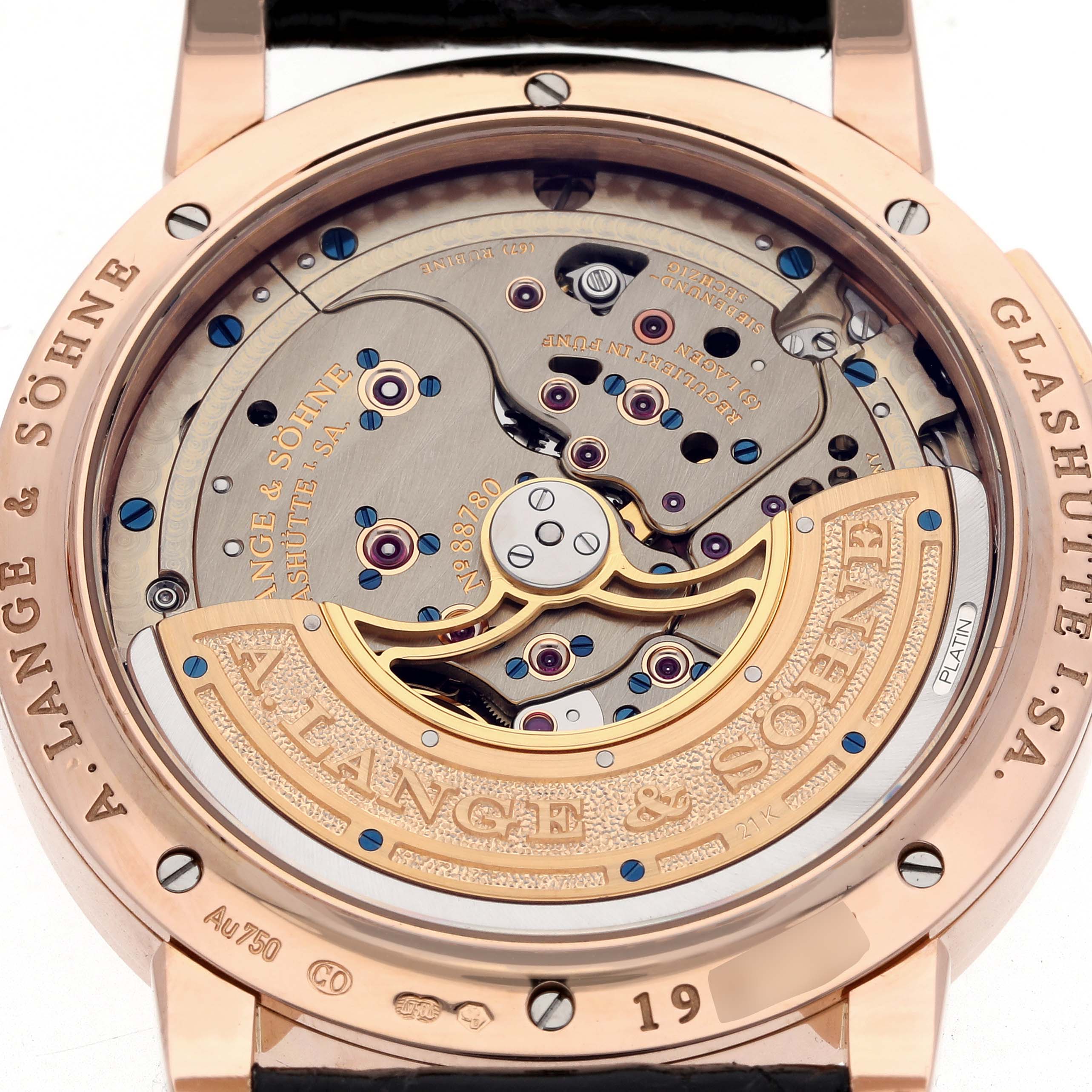 The image shows the back of the Lange 1 by A. Lange 
Söhne, highlighting its intricate movement and rotor.
