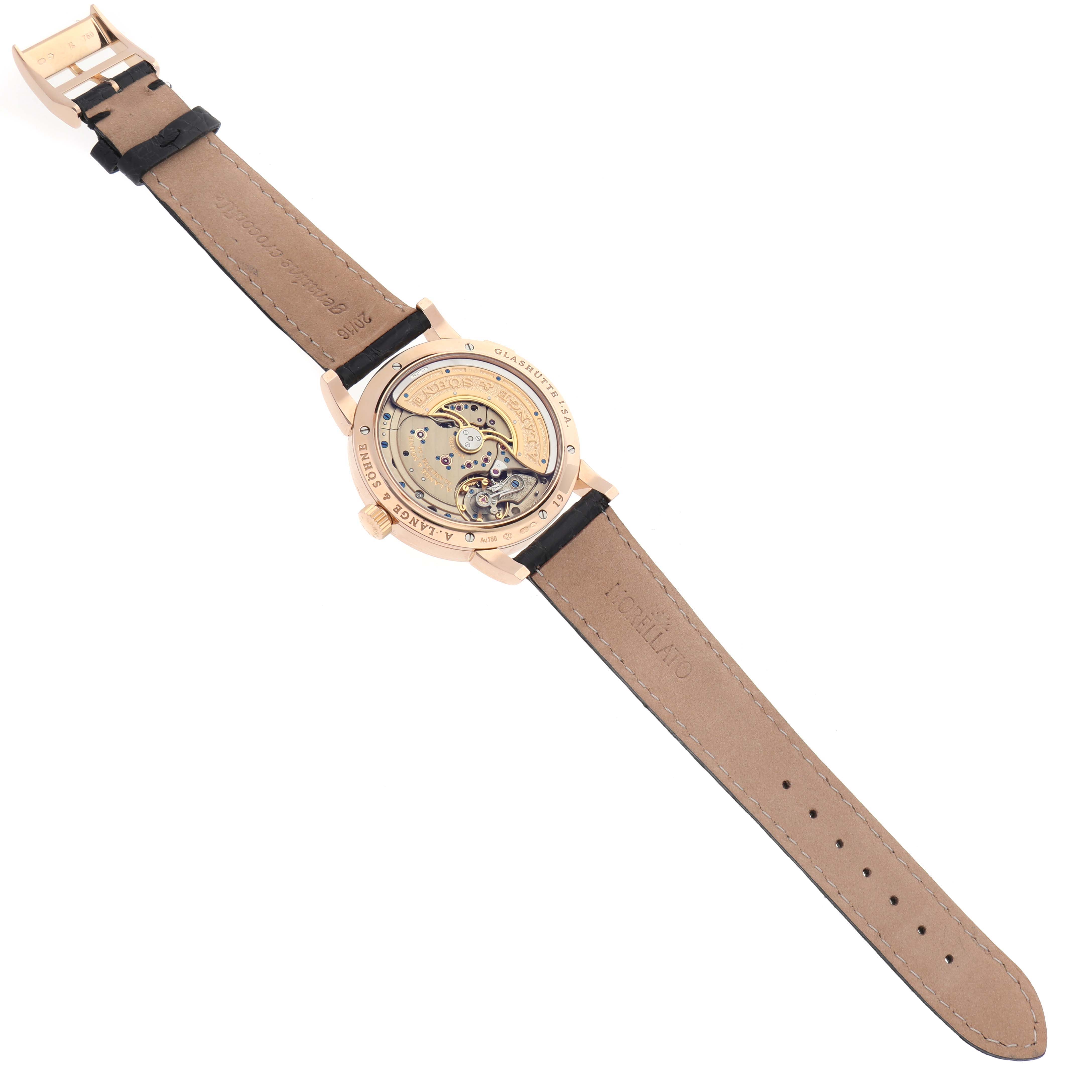 The image shows the back view of the A. Lange 
Sohne Lange 1 320.032 Men
s Rose Gold Silver Dial watch, highlighting its mechanical movement.