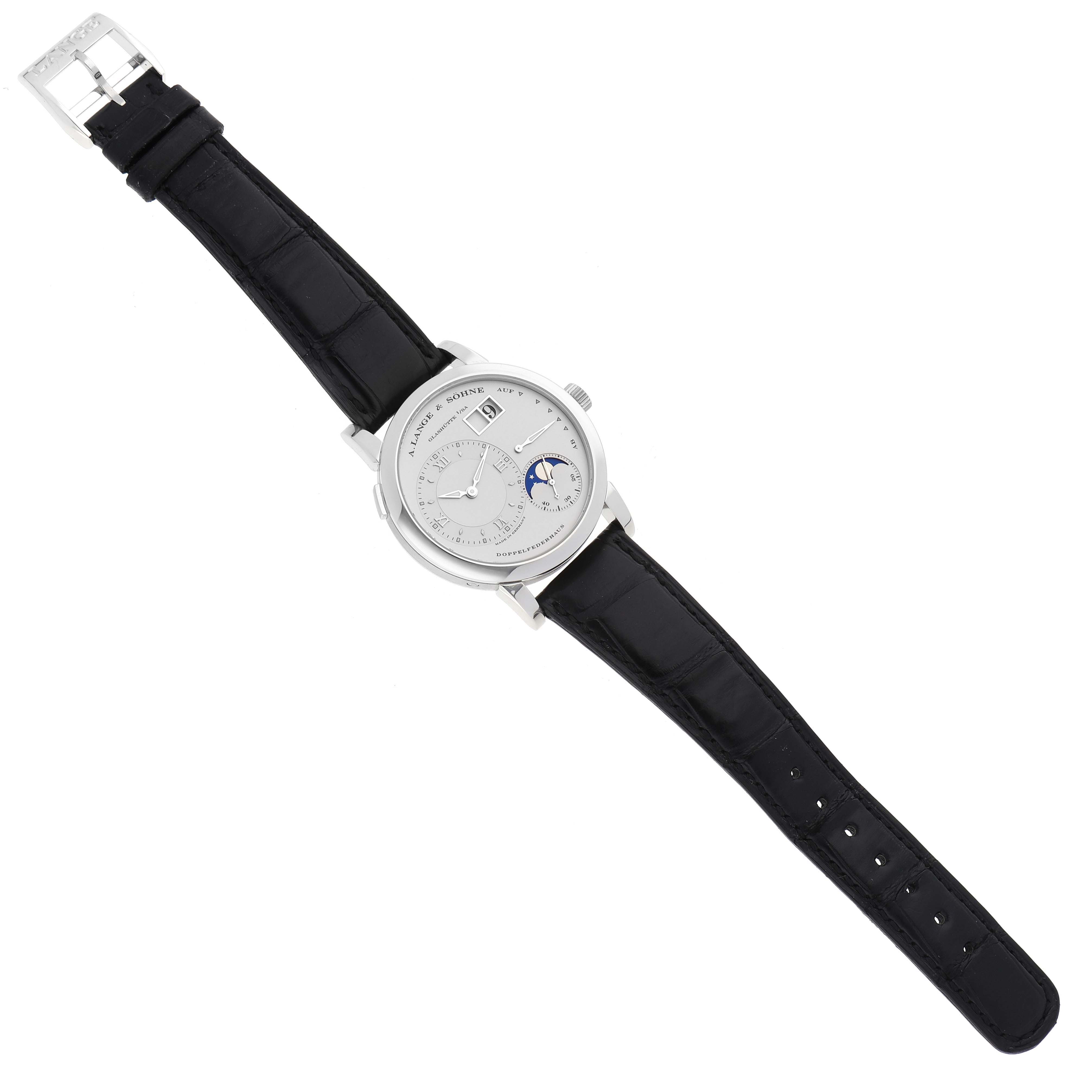 The A. Lange & Sohne Lange 1 109.025 Men's Platinum Silver Dial watch is shown from a top-down angle, displaying its face and black leather strap.