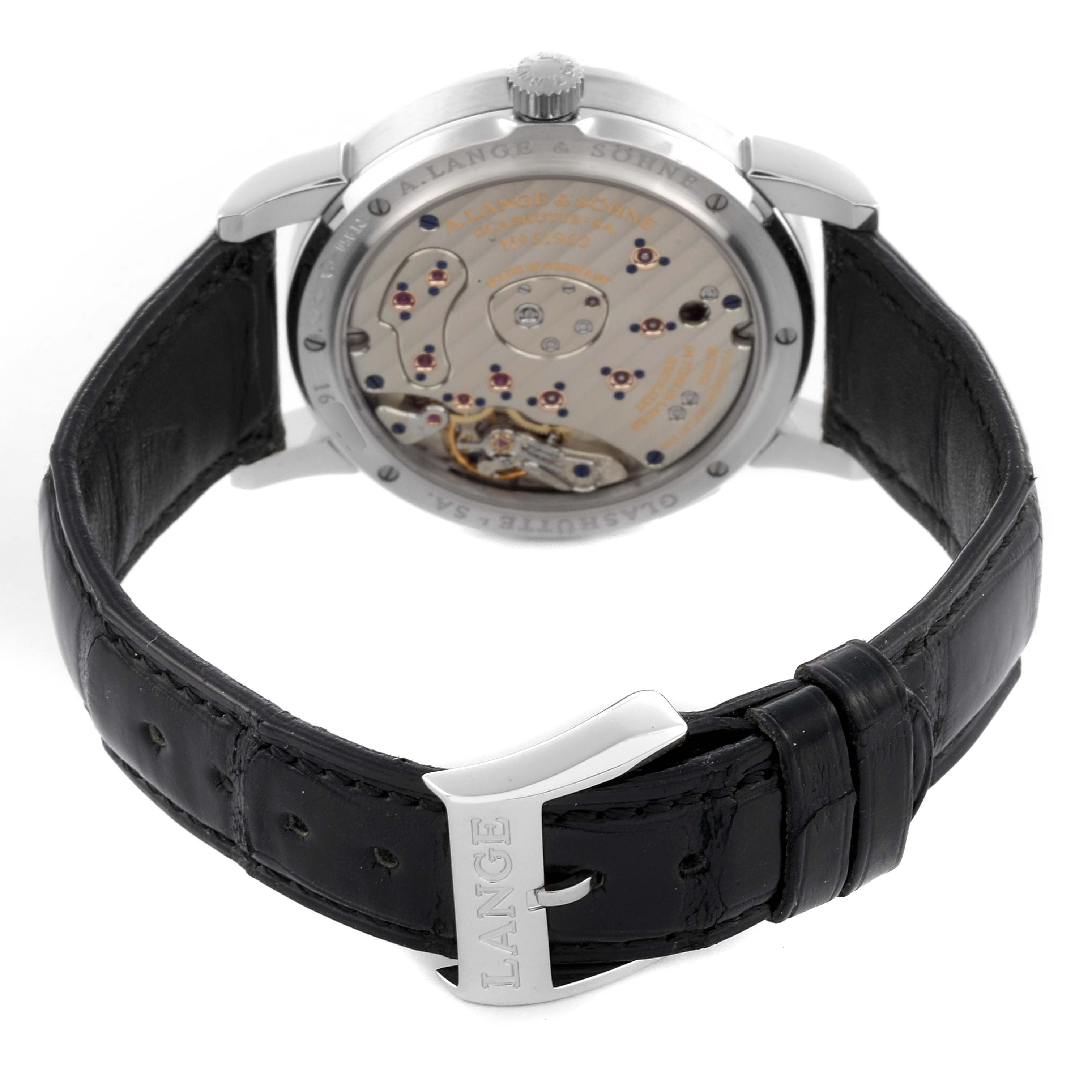 The A. Lange & Sohne Lange 1 109.025 Men's Platinum Silver Dial watch is shown from the back, highlighting its movement and leather strap.