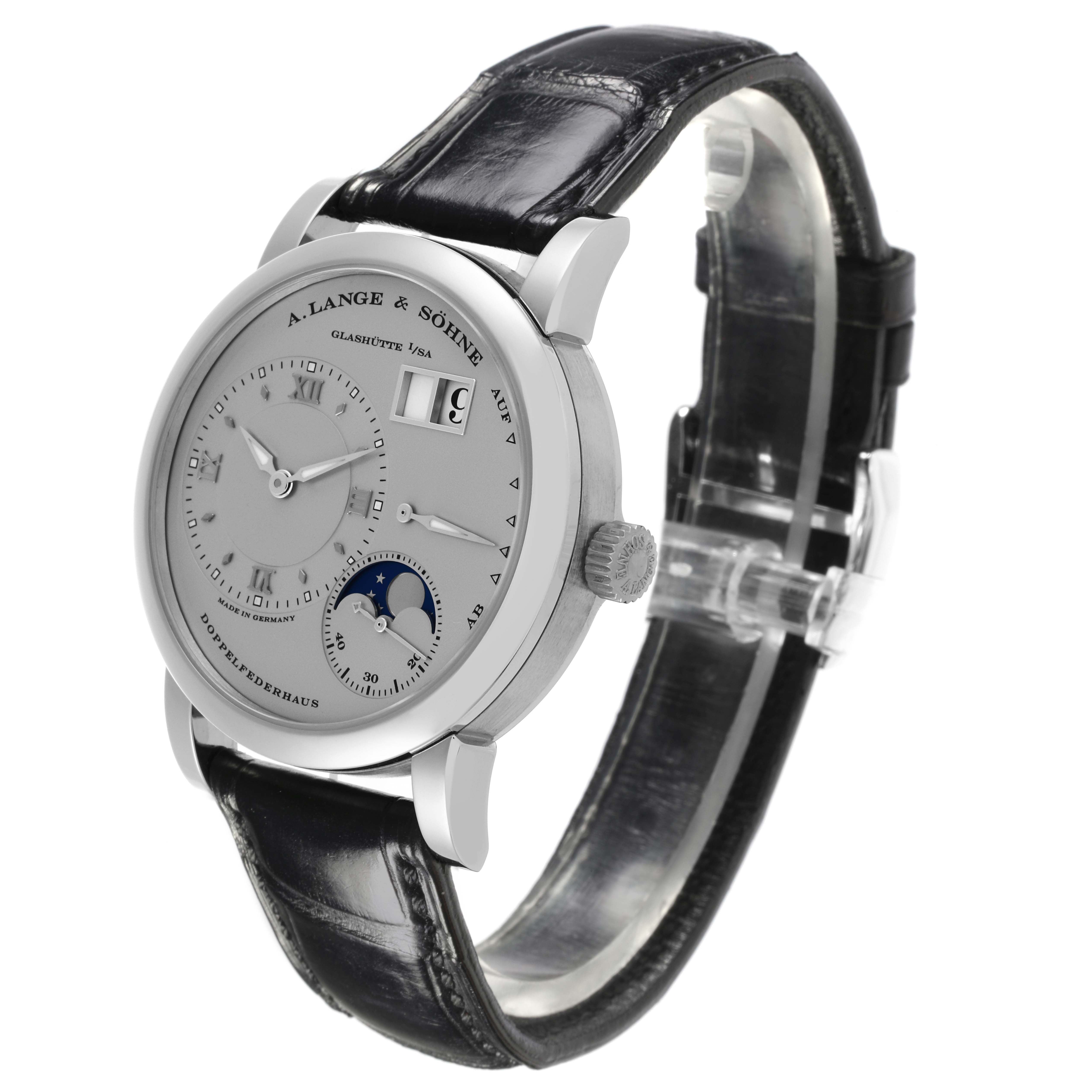 The A. Lange & Sohne Lange 1 109.025 Men's Platinum Silver Dial watch is shown at a side angle, displaying the dial, crown, and black leather strap.