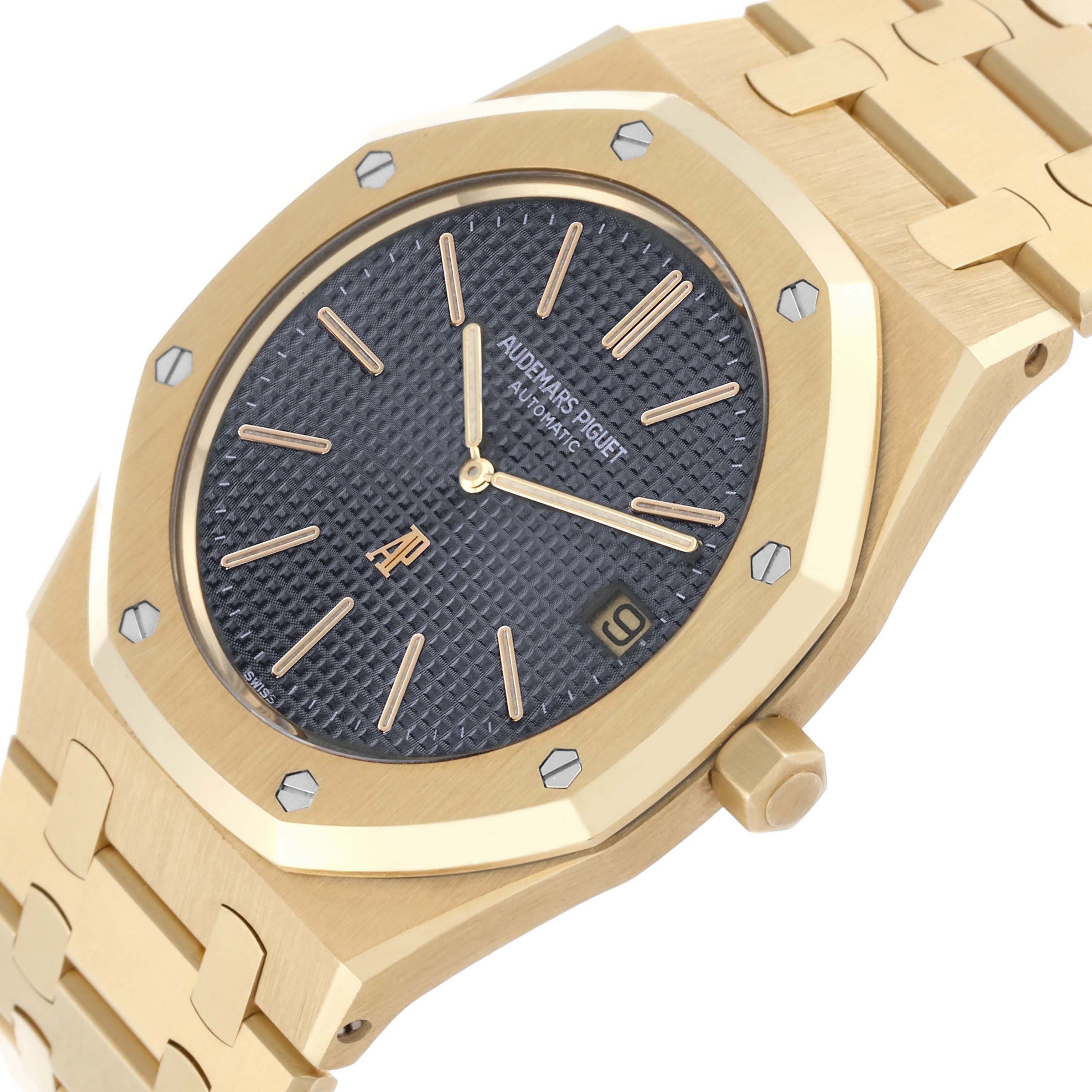 The image shows a close-up of the Audemars Piguet Royal Oak 5402BA-001 Men's Yellow Gold Grey Dial's face, bezel, and part of the bracelet from a diagonal angle.