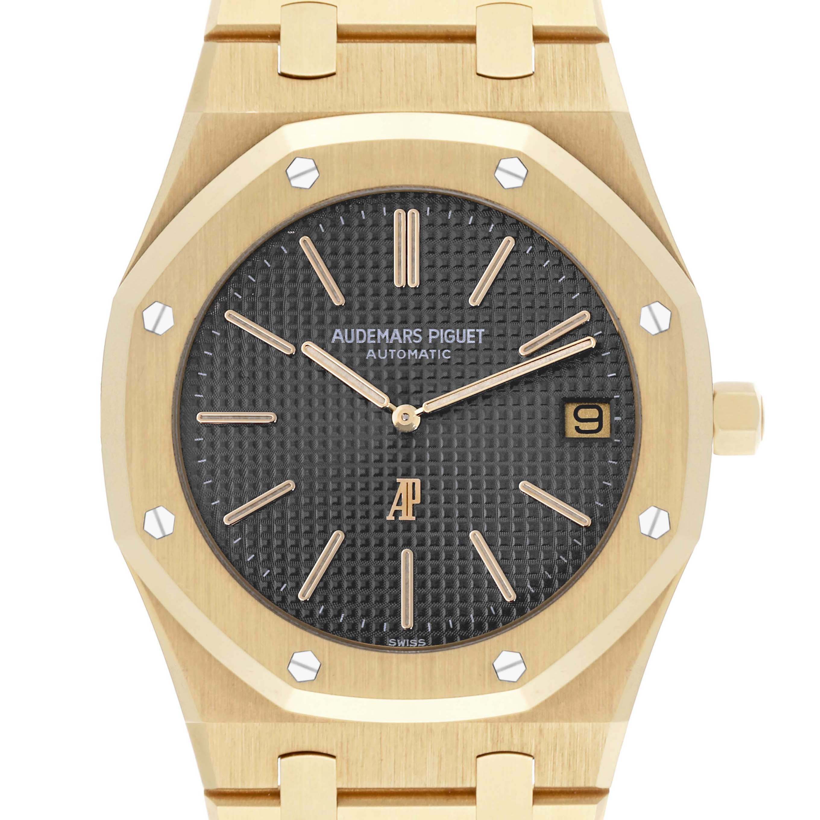 The Audemars Piguet Royal Oak 5402BA-001 Men's Yellow Gold Grey Dial 5402BA-001 Men's Yellow Gold Grey Dial watch is shown from the front, featuring the dial, hands, and part of the bracelet.