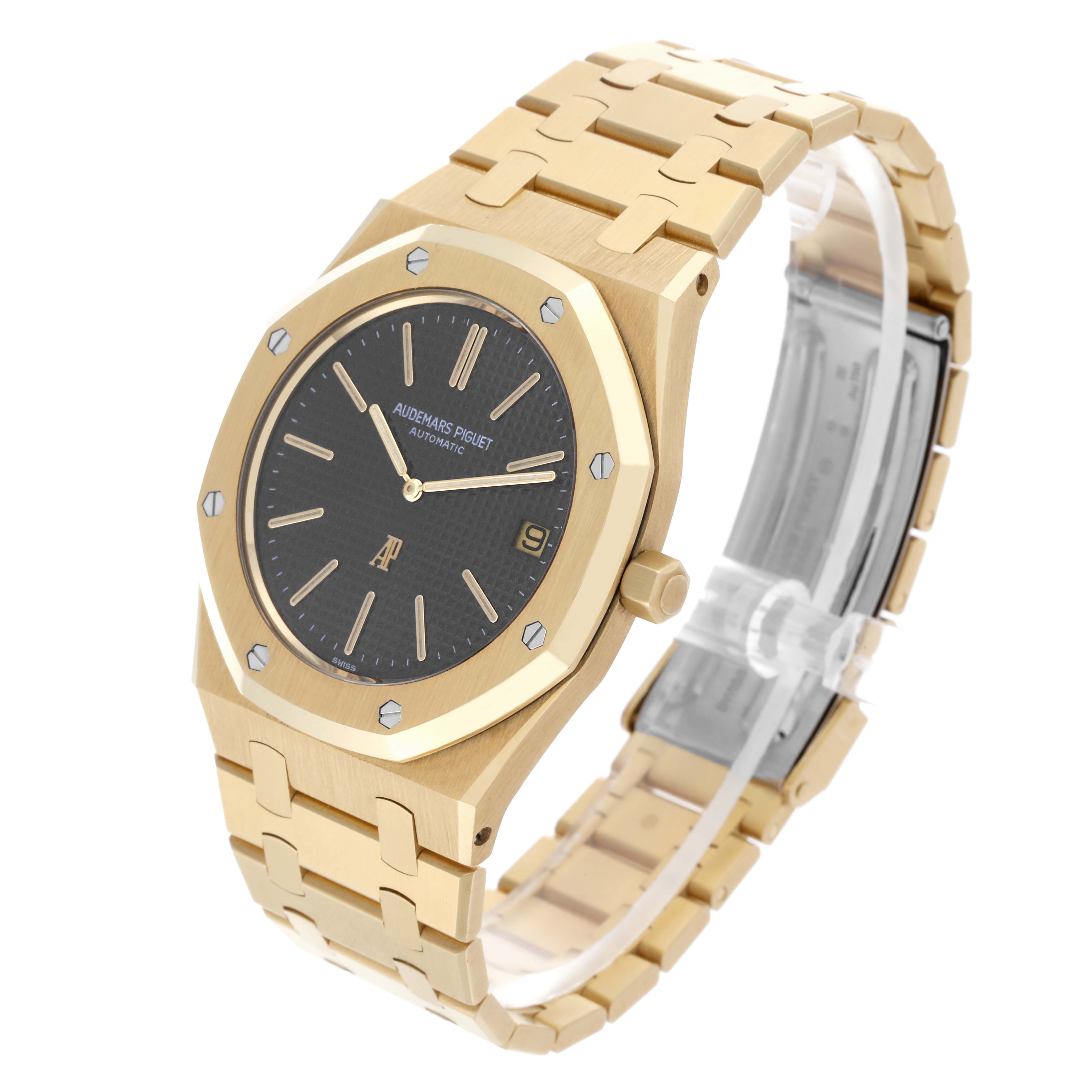 The Audemars Piguet Royal Oak 5402BA-001 Men's Yellow Gold Grey Dial 5402BA-001 Men's Yellow Gold Grey Dial watch is shown at a three-quarter angle, displaying the face, bezel, crown, and bracelet.