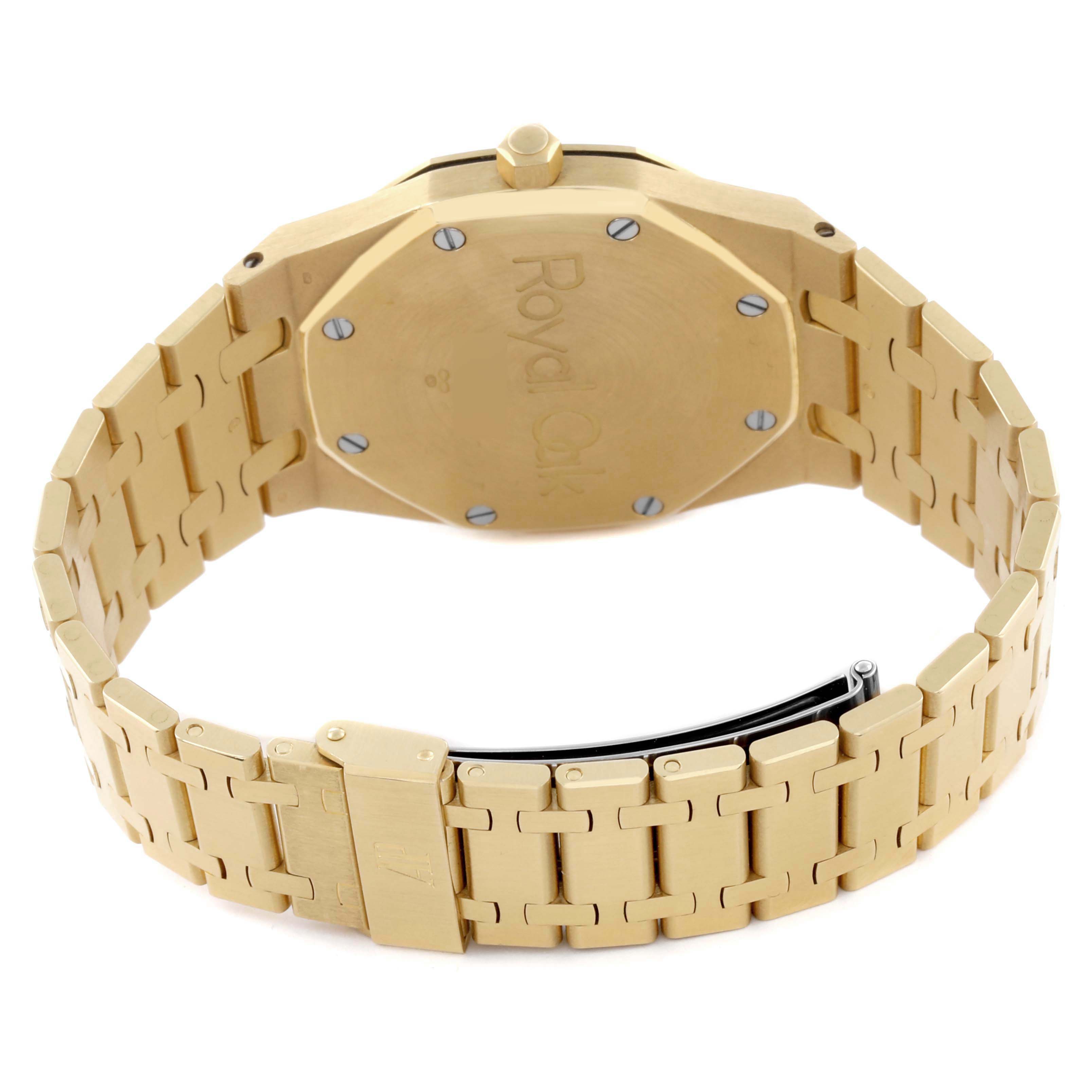 The image shows the back and bracelet of the Audemars Piguet Royal Oak 5402BA-001 Men's Yellow Gold Grey Dial 5402BA-001 Men's Yellow Gold Grey Dial watch, highlighting its clasp and caseback.