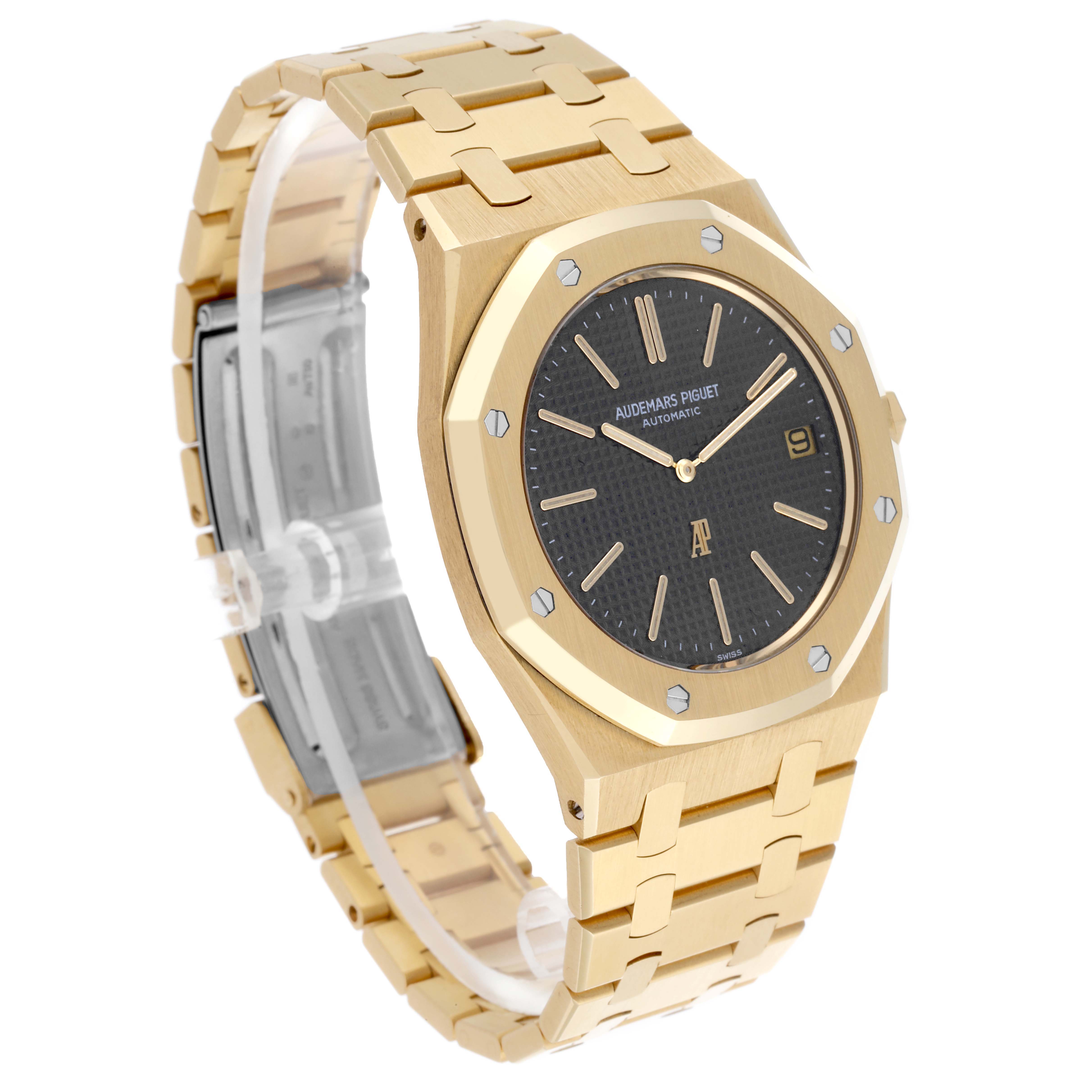 The Audemars Piguet Royal Oak 5402BA-001 Men's Yellow Gold Grey Dial 5402BA-001 Men's Yellow Gold Grey Dial watch is shown at a three-quarter angle, highlighting the face, bezel, and bracelet.