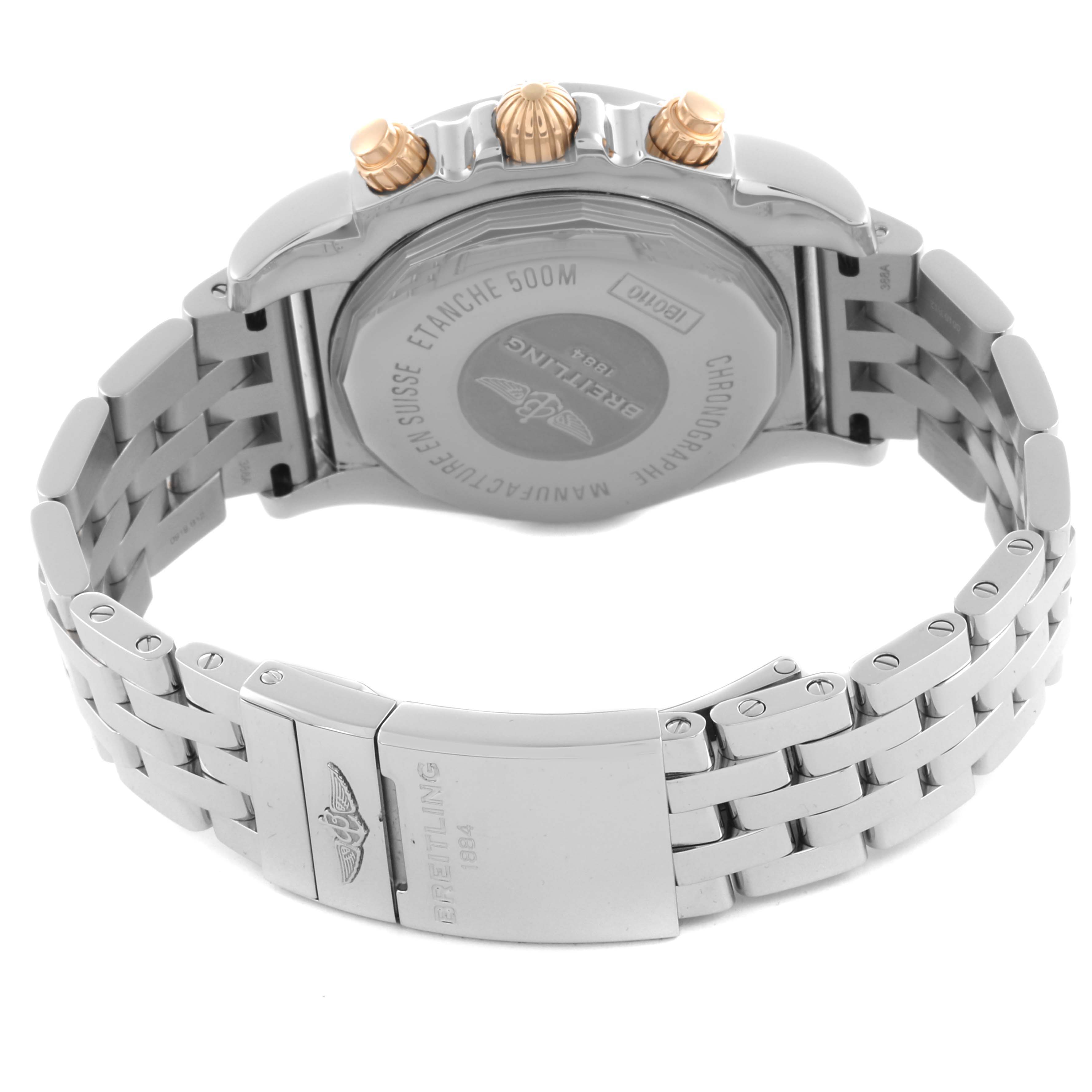 The Breitling Chronomat IB0110 Men's Steel and Gold (two tone) Black Dial IB0110 Men's Steel and Gold (two tone) Black Dial watch is shown from the back and side, highlighting the clasp, case back, and crown.