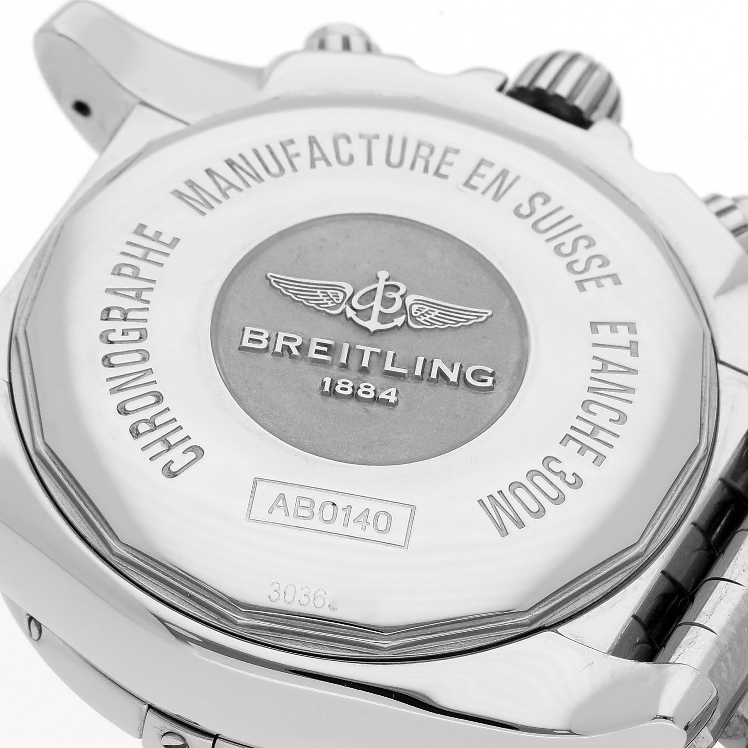 The image shows the back case and part of the bracelet of a Breitling Chronomat AB0140 Men's Stainless Steel Mother of Pearl Dial AB0140 Men's Stainless Steel Mother of Pearl Dial watch, highlighting the branding and specifications.