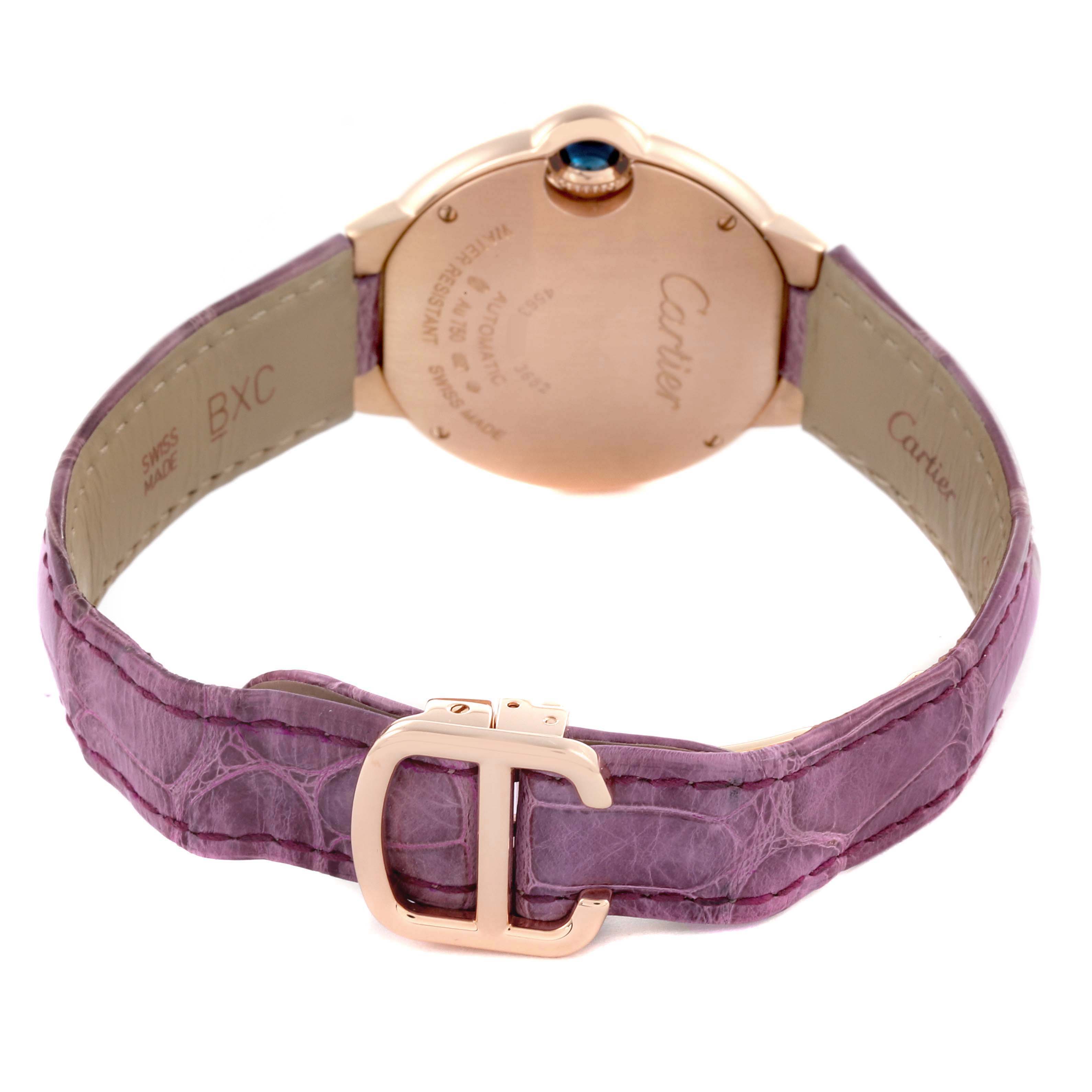 The image shows the back view of the Cartier Ballon Bleu WE902066 Women's Rose Gold Silver Dial WE902066 Women's Rose Gold Silver Dial watch with a pink leather strap and rose gold clasp.