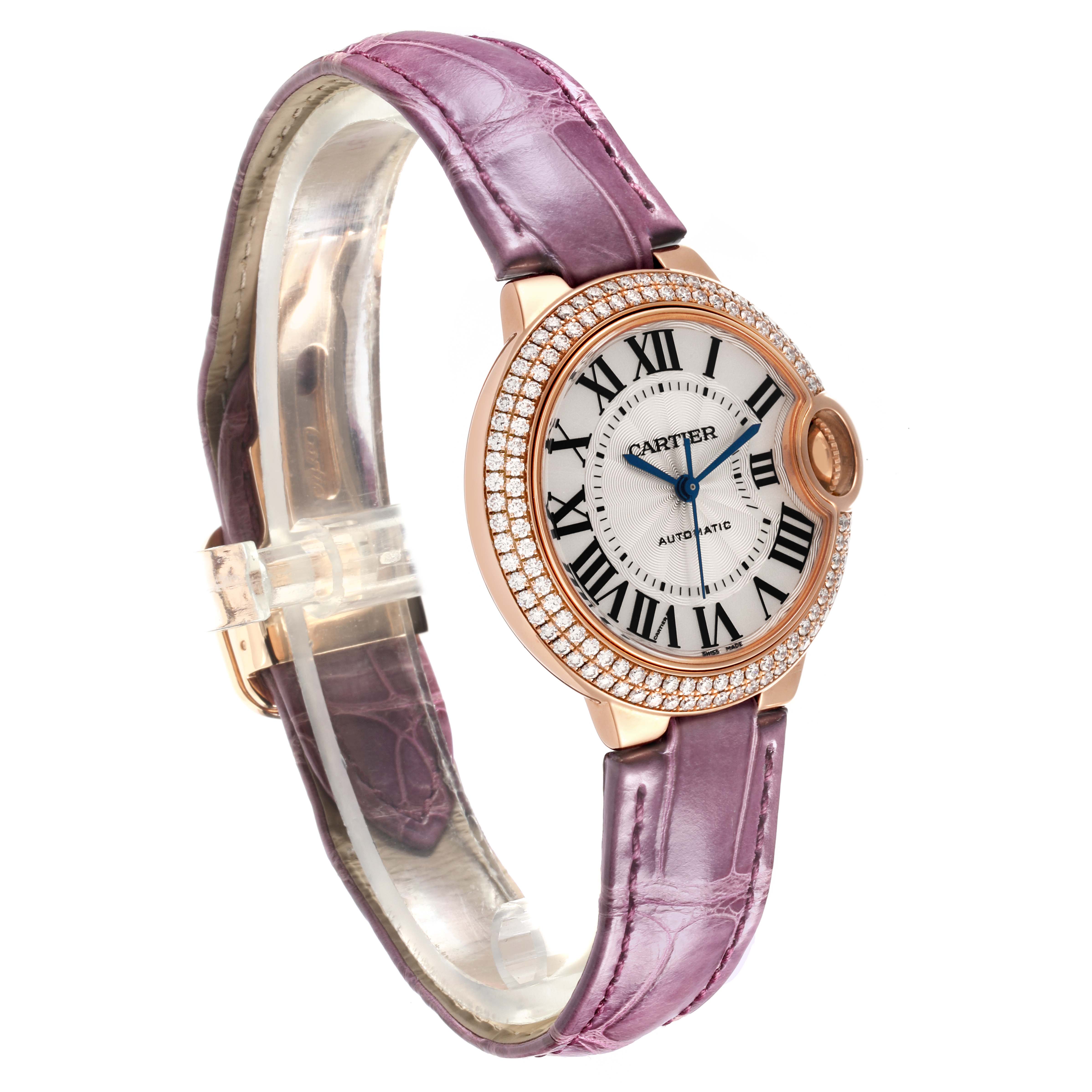 The Cartier Ballon Bleu WE902066 Women's Rose Gold Silver Dial WE902066 Women's Rose Gold Silver Dial watch is shown from a side angle, featuring its round dial, diamond bezel, and purple leather strap.