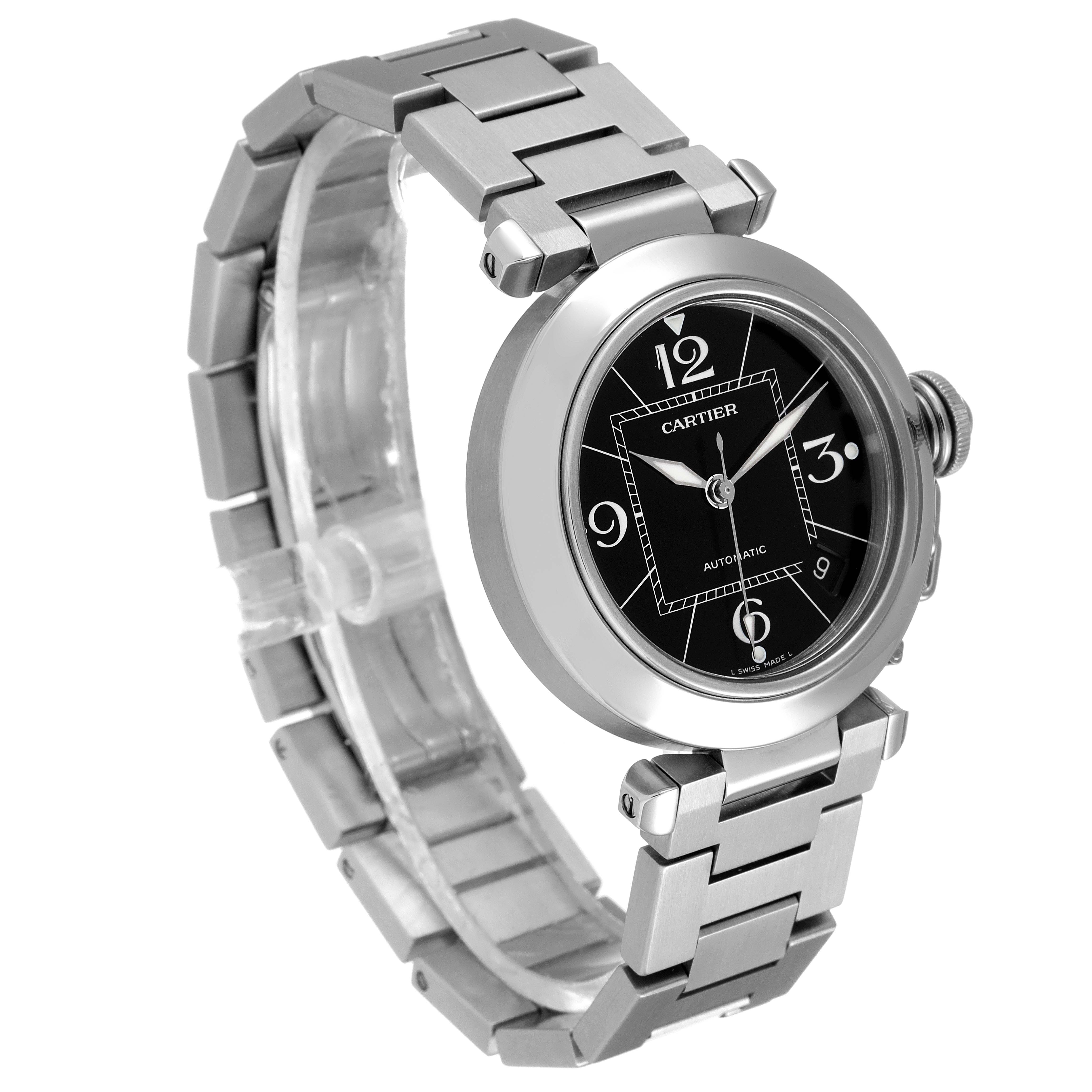The image shows a Cartier Pasha W31076M7 Men's Stainless Steel Black Dial W31076M7 Men's Stainless Steel Black Dial watch at an oblique angle, highlighting its stainless steel band, round case, and black dial.