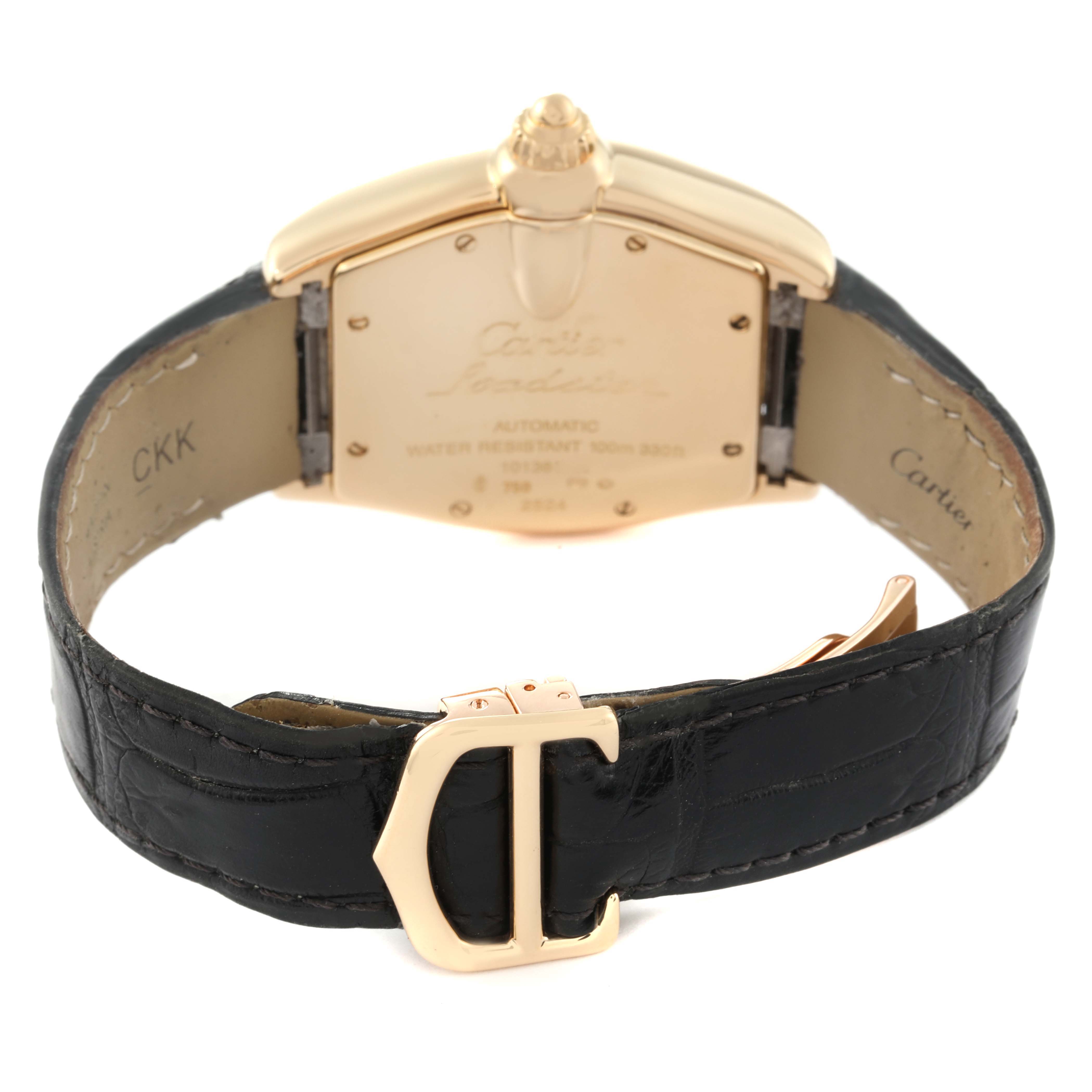 The image shows the back view of a Cartier Roadster W62005V2 Men's Yellow Gold Silver Dial W62005V2 Men's Yellow Gold Silver Dial watch, focusing on the clasp, strap, and case back.