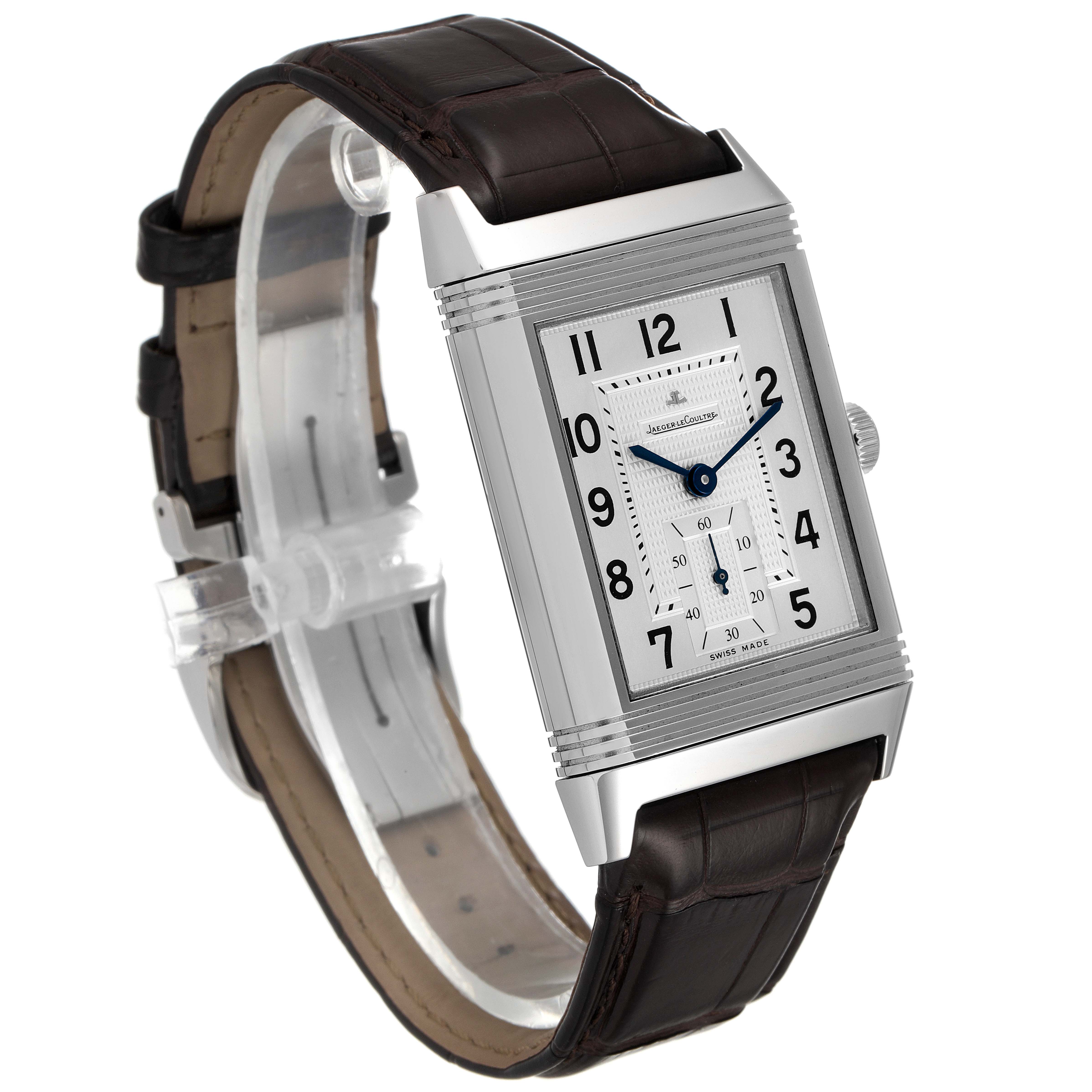 The Jaeger-LeCoultre Reverso watch is shown at a slight angle, highlighting its rectangular face and leather strap.