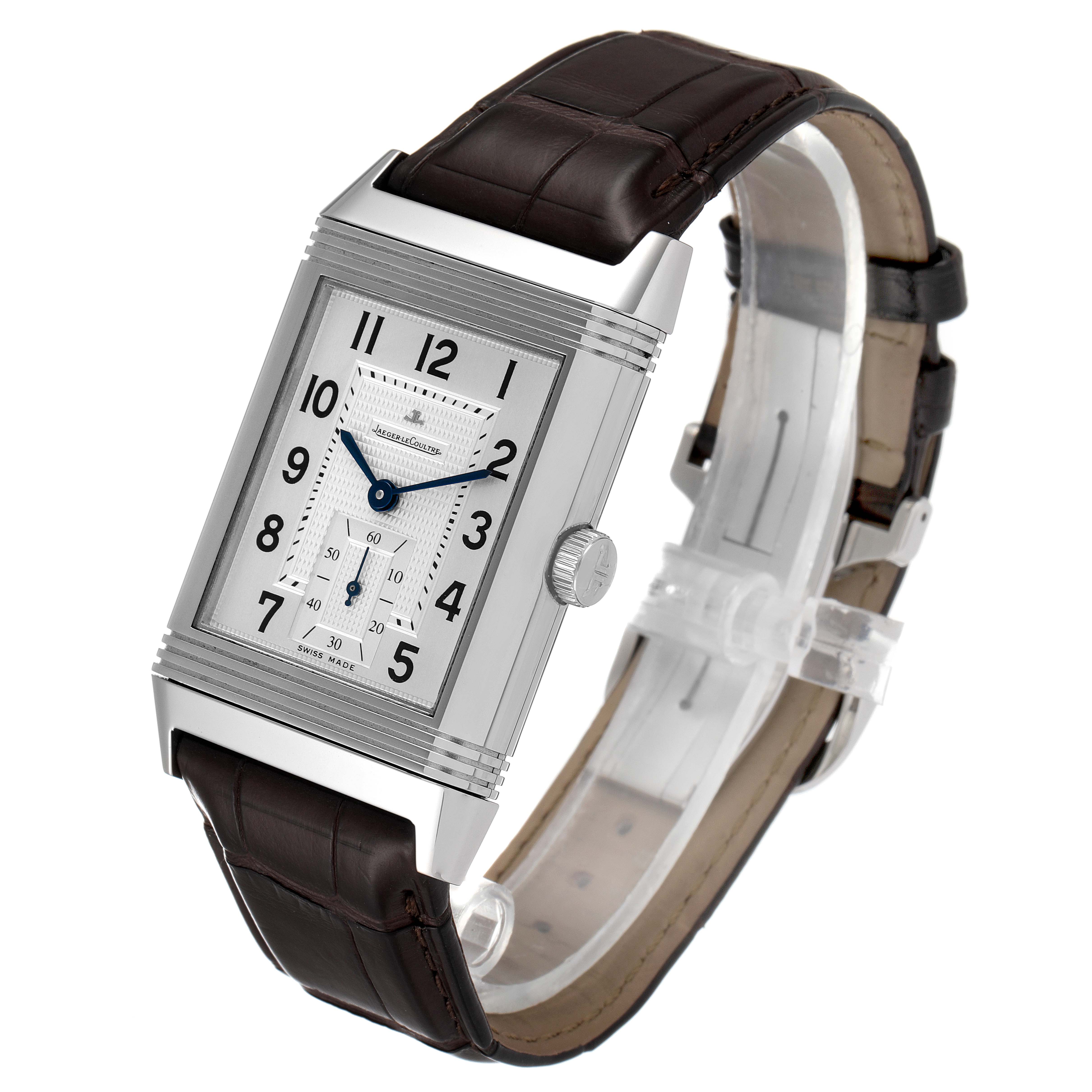 This image shows a Jaeger LeCoultre Reverso Q3738420 Men's Stainless Steel Silver Dial Q3738420 Men's Stainless Steel Silver Dial watch at a slight angle, highlighting its face, case, crown, and leather strap.