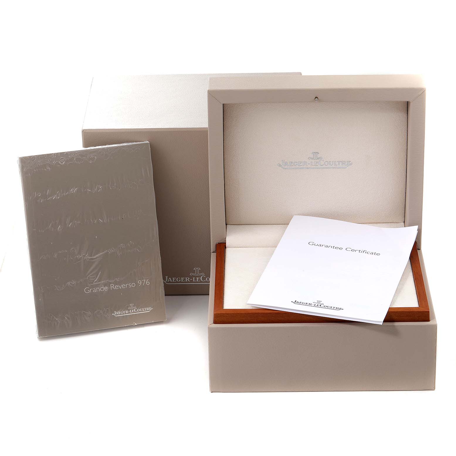 The image shows the packaging, including the box, outer sleeve, and guarantee certificate for a Jaeger LeCoultre Reverso Q3738420 Men's Stainless Steel Silver Dial Q3738420 Men's Stainless Steel Silver Dial watch.