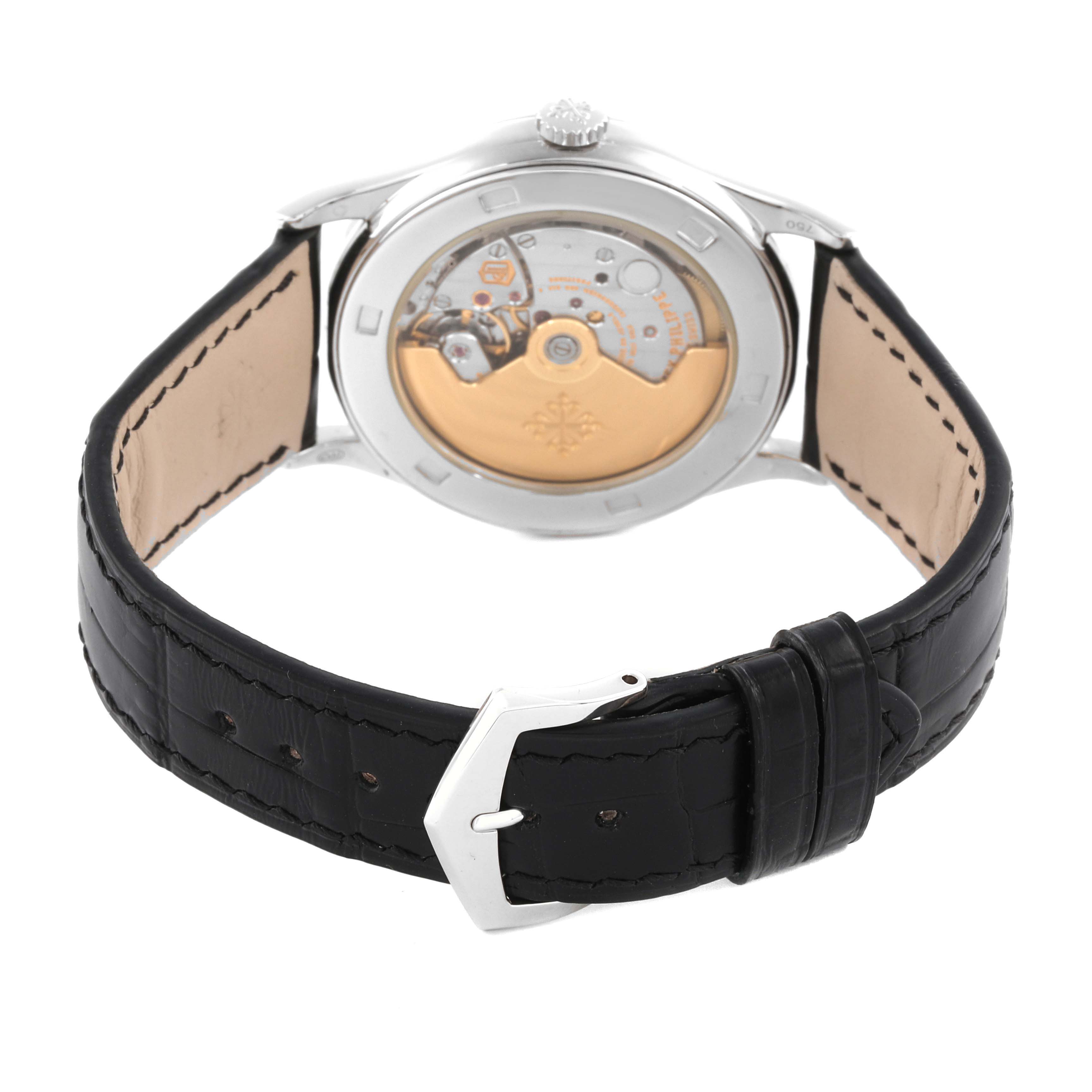 The image shows the back view of a Patek Philippe Calatrava 5297G-001 Men's White Gold Black Dial 5297G-001 Men's White Gold Black Dial, highlighting its mechanical movement and leather strap.