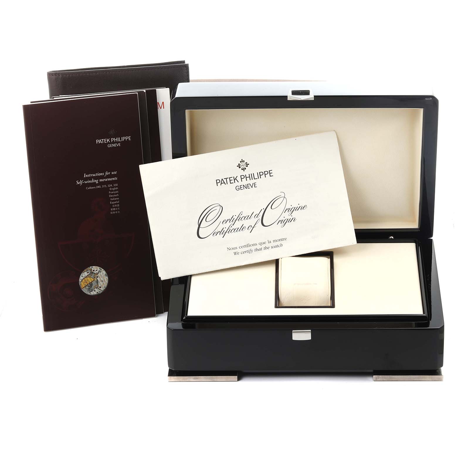 The image shows the packaging and documentation, including the box and certificate of origin, for the Patek Philippe Calatrava 5297G-001 Men's White Gold Black Dial 5297G-001 Men's White Gold Black Dial watch.