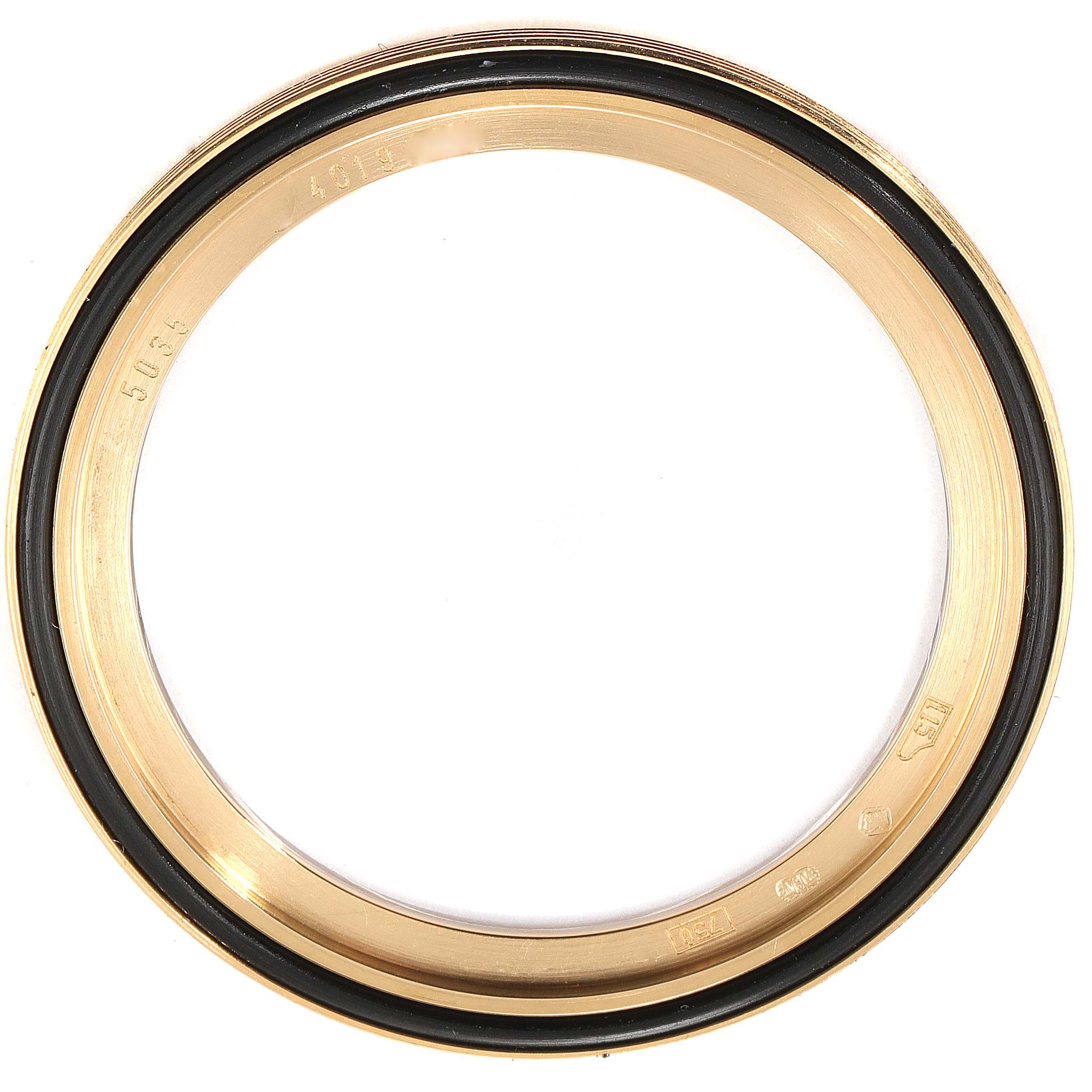 This is a close-up image of the bezel for a Patek Philippe Complications 5035G Men's Yellow Gold Silver Dial 5035G Men's Yellow Gold Silver Dial model watch.