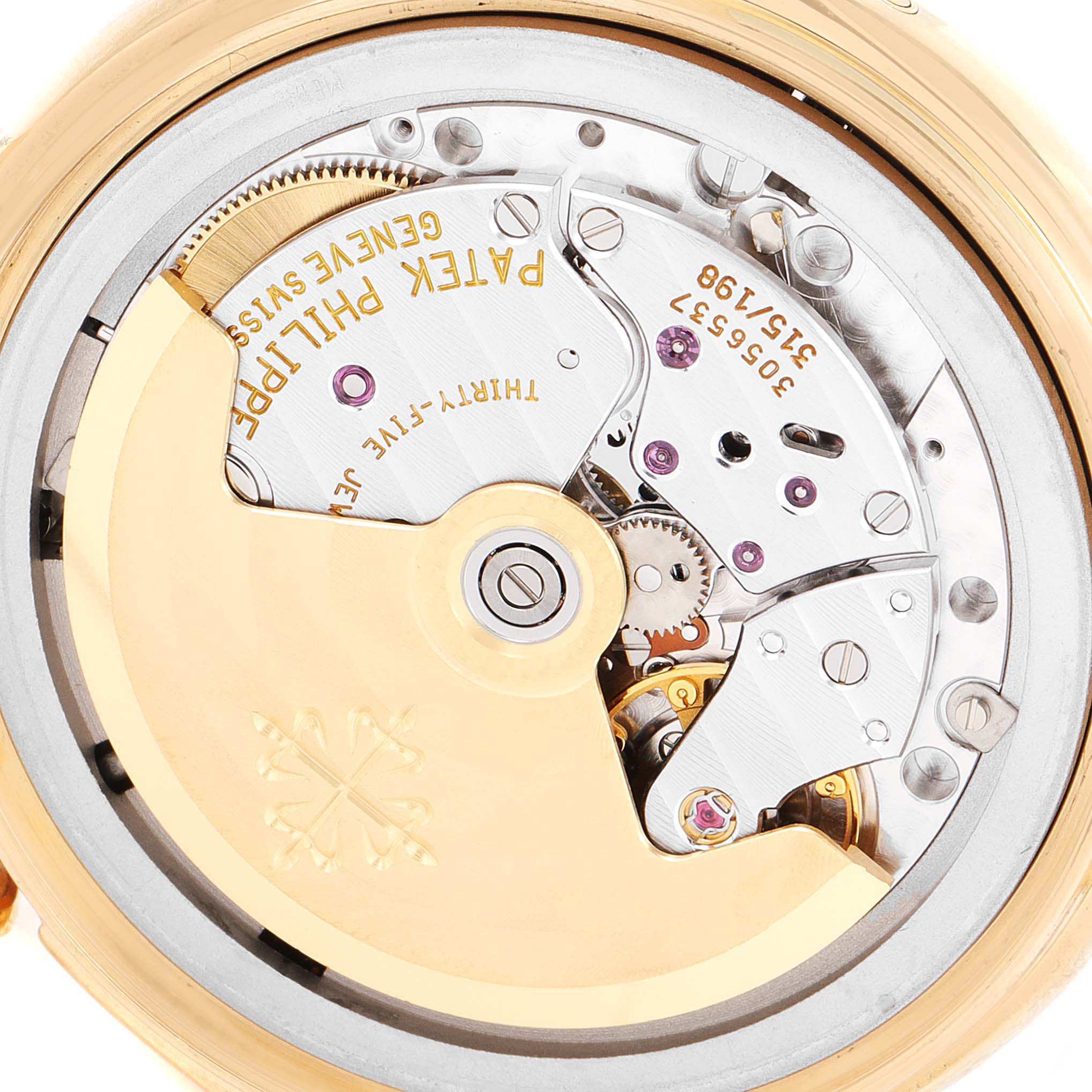 The image shows the back view of a Patek Philippe Complications 5035G Men's Yellow Gold Silver Dial 5035G Men's Yellow Gold Silver Dial watch, highlighting its intricate movement and caliber details.