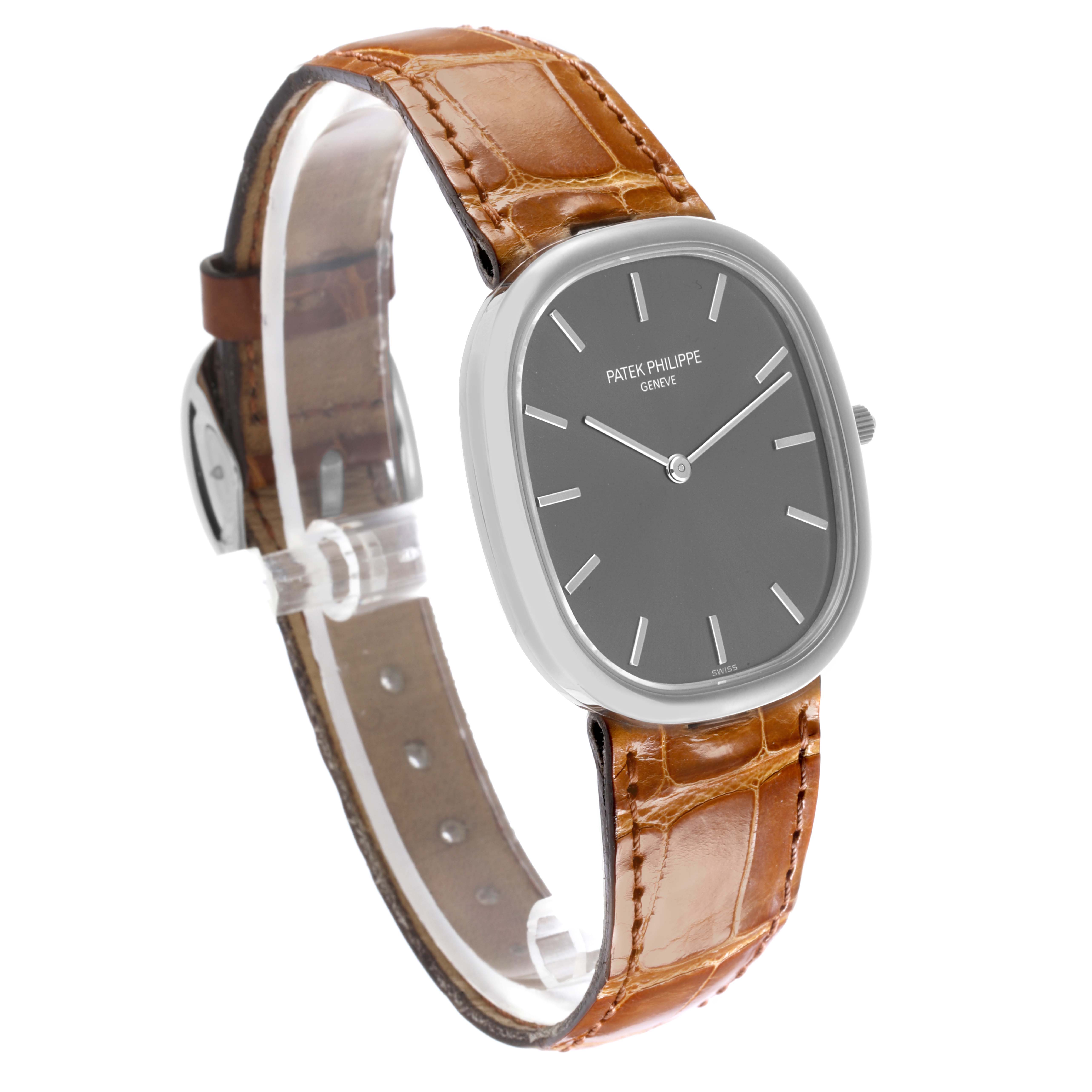 The Patek Philippe Golden Ellipse 3738/100G Men's White Gold Grey Dial 3738/100G Men's White Gold Grey Dial watch is shown at a slight angle, highlighting the dial, bezel, and brown leather strap.