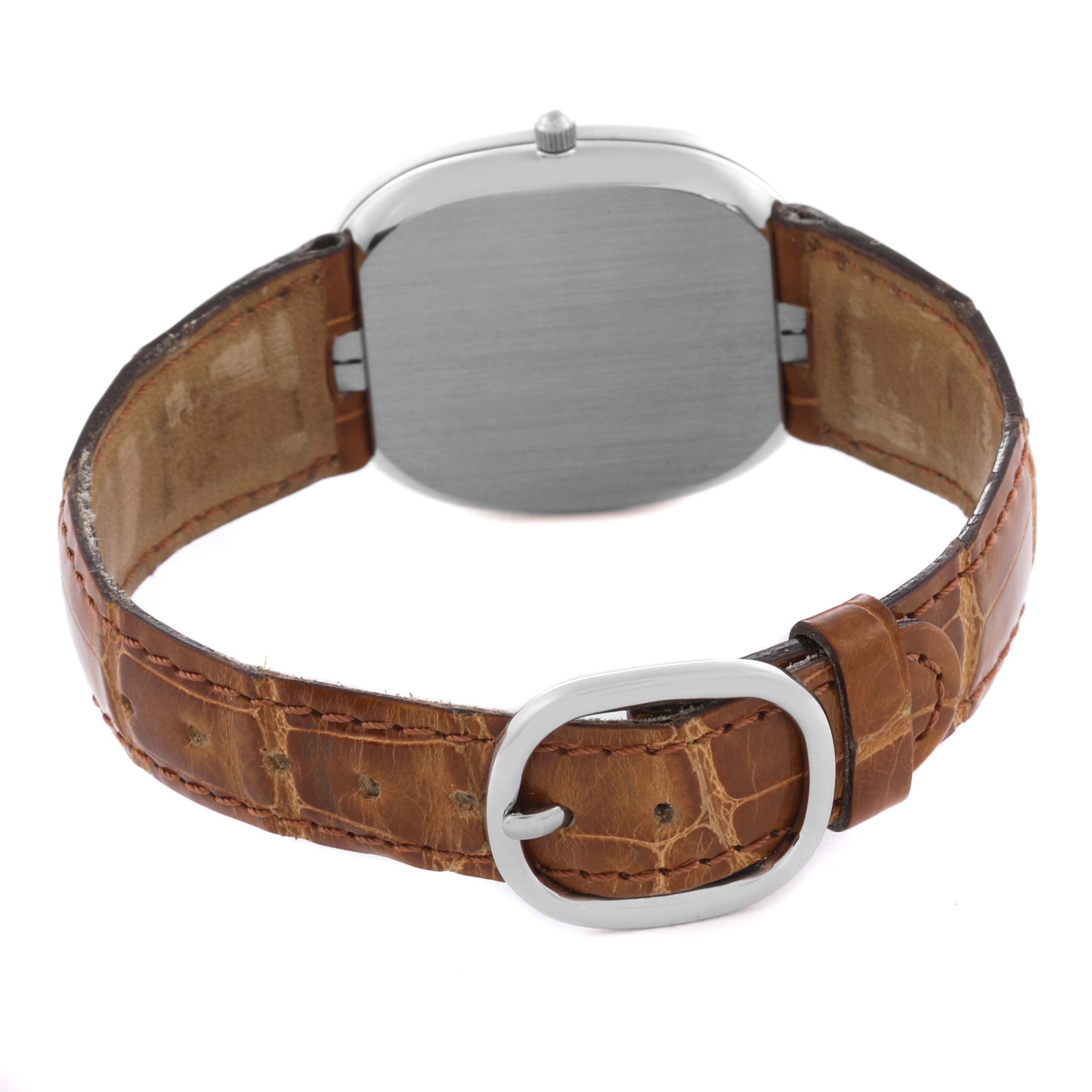 The image shows the back view of a Patek Philippe Golden Ellipse 3738/100G Men's White Gold Grey Dial 3738/100G Men's White Gold Grey Dial watch, highlighting the case back and brown leather strap with buckle.