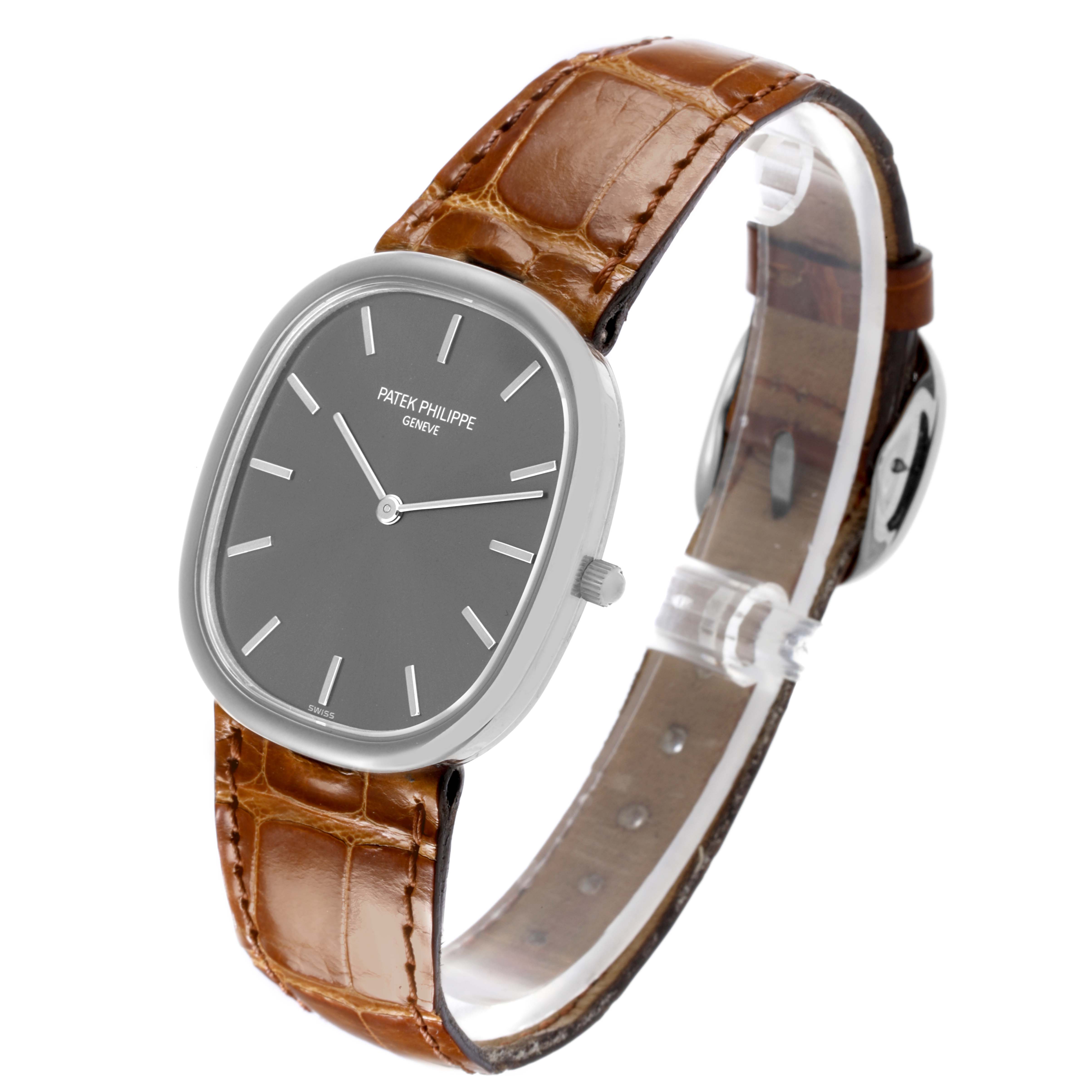 The Patek Philippe Golden Ellipse 3738/100G Men's White Gold Grey Dial 3738/100G Men's White Gold Grey Dial watch is shown at an angled front view, displaying the watch face, case, and leather strap.