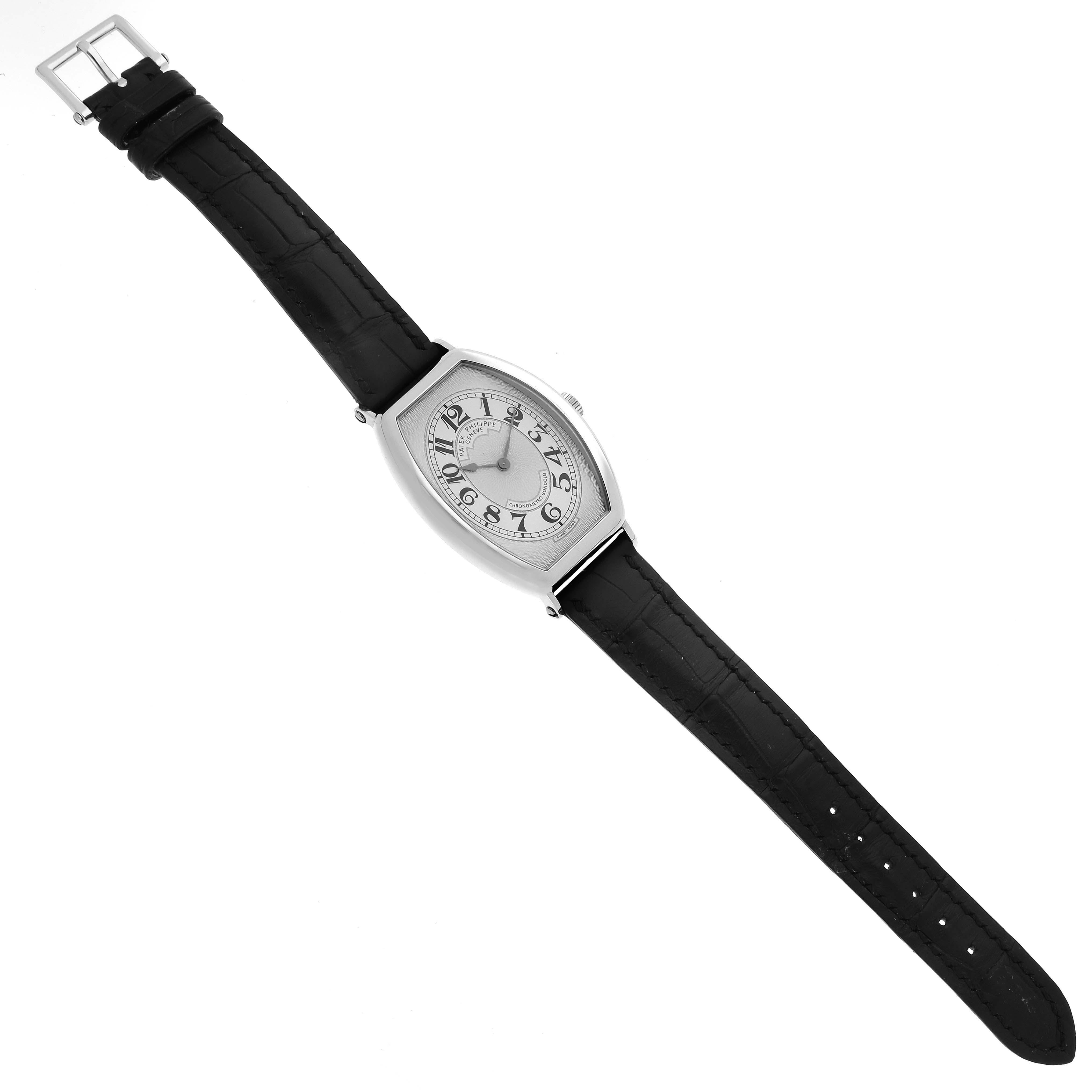 The Patek Philippe Gondolo 5098P-001 Men's Platinum Silver Dial 5098P-001 Men's Platinum Silver Dial watch is shown from a top-down angle, displaying the face, case, and leather strap.