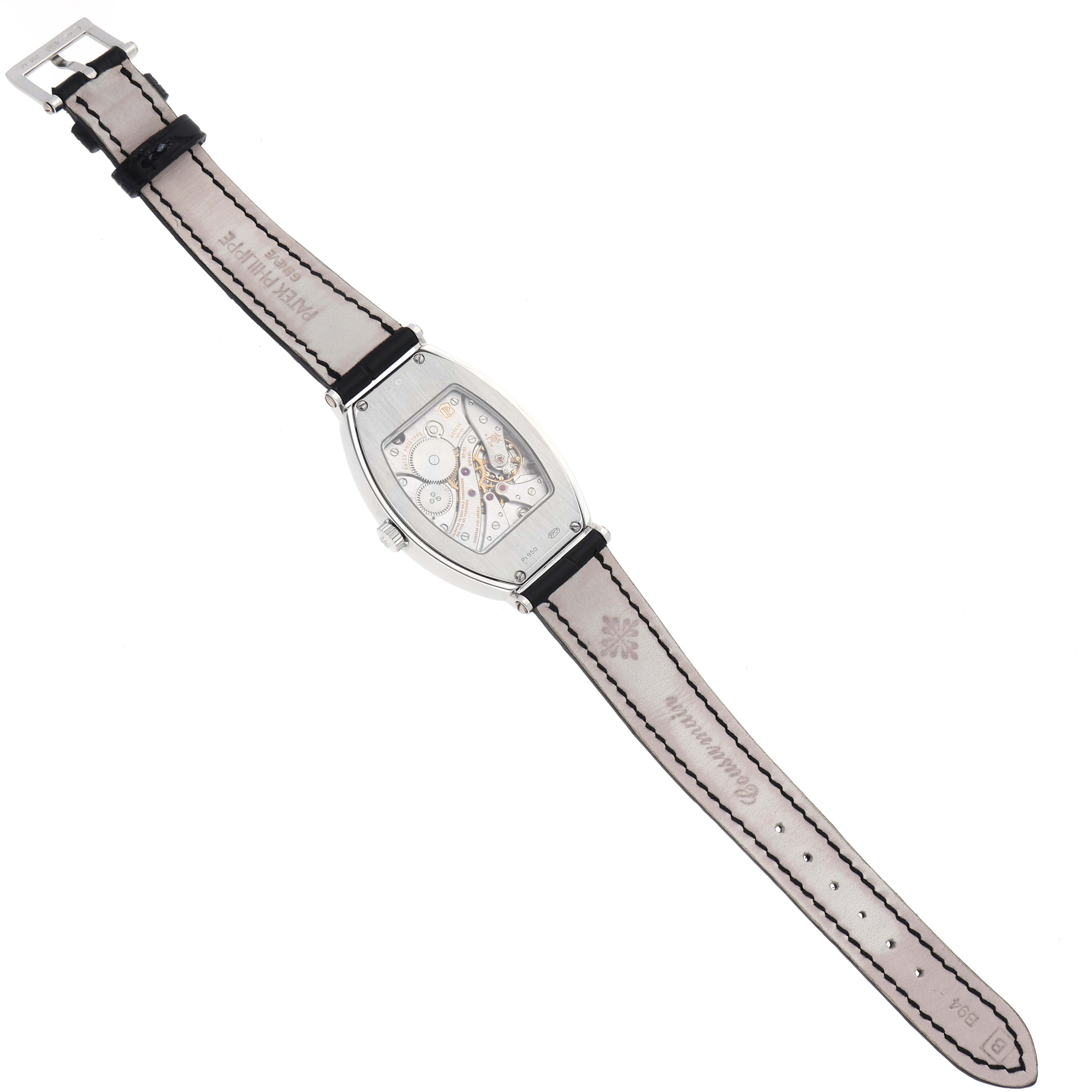 The Patek Philippe Gondolo 5098P-001 Men's Platinum Silver Dial 5098P-001 Men's Platinum Silver Dial watch is shown from the back, displaying the movement and the inside of the leather strap.
