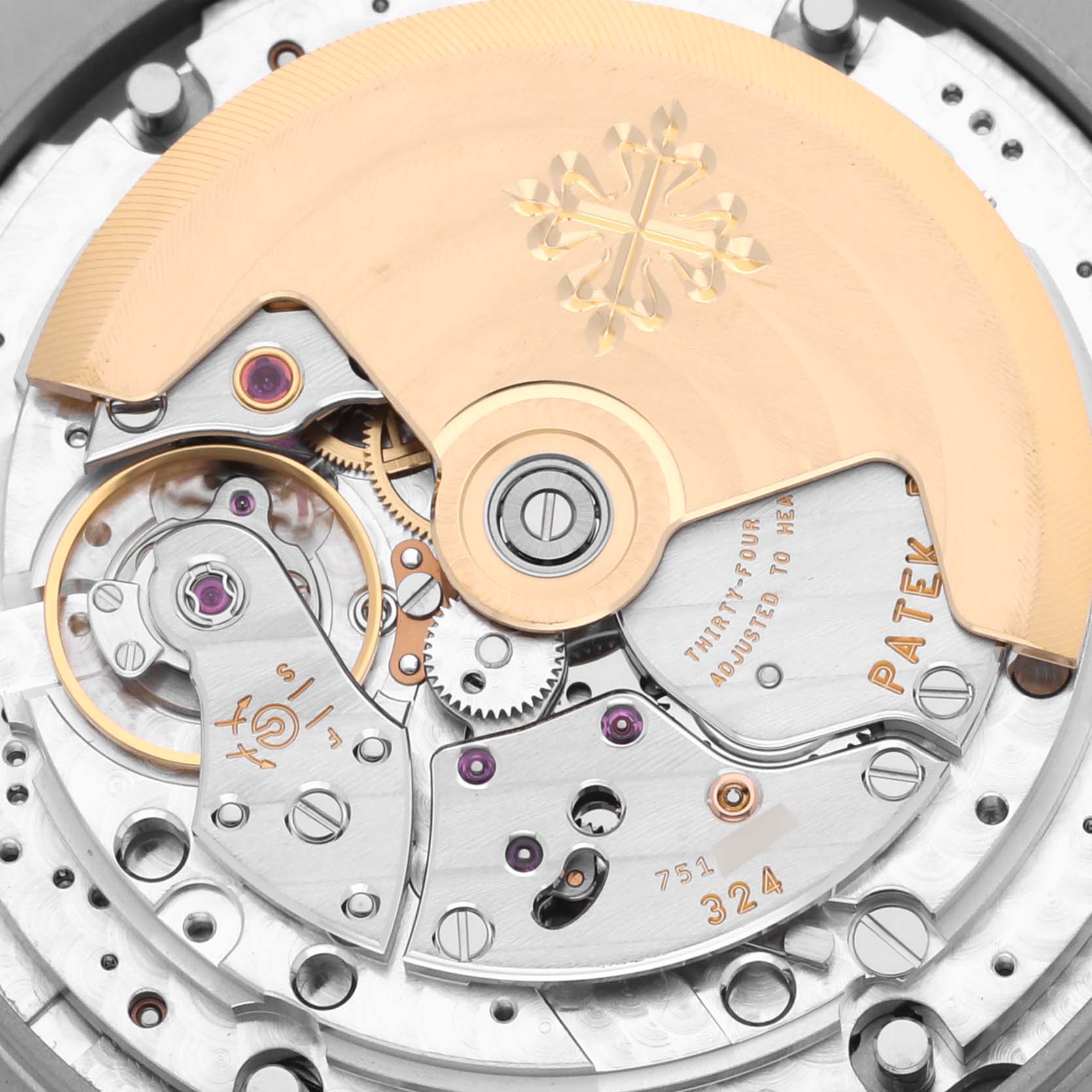 The image shows a close-up of the Patek Philippe Nautilus 5726A-001 Men's Stainless Steel Black Dial 5726A-001 Men's Stainless Steel Black Dial movement, highlighting the rotor and intricate internal mechanisms.