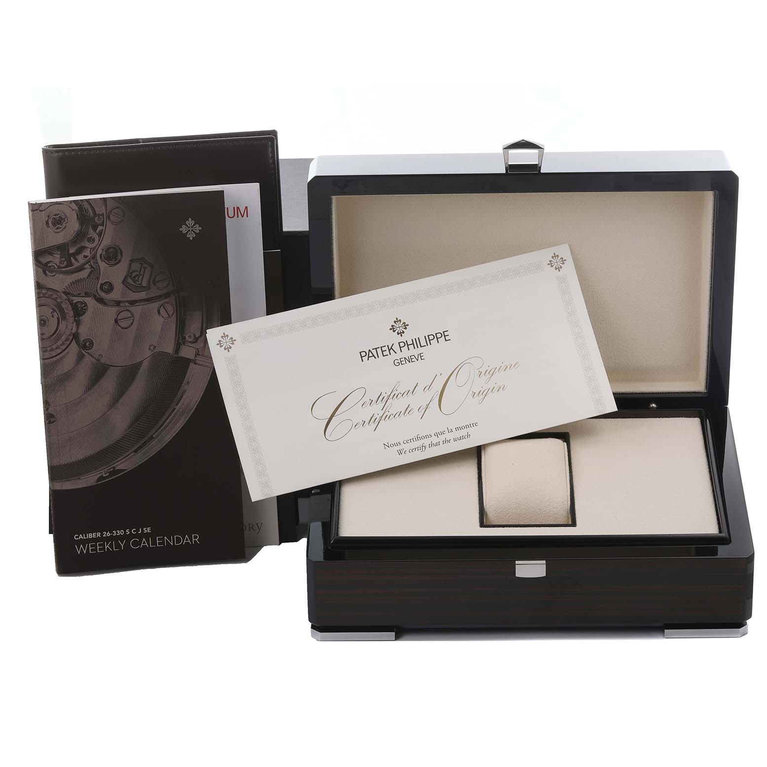 The image shows a Patek Philippe Nautilus 5726A-001 Men's Stainless Steel Black Dial 5726A-001 Men's Stainless Steel Black Dial watch box, certificate of origin, and a booklet, viewed from the front.
