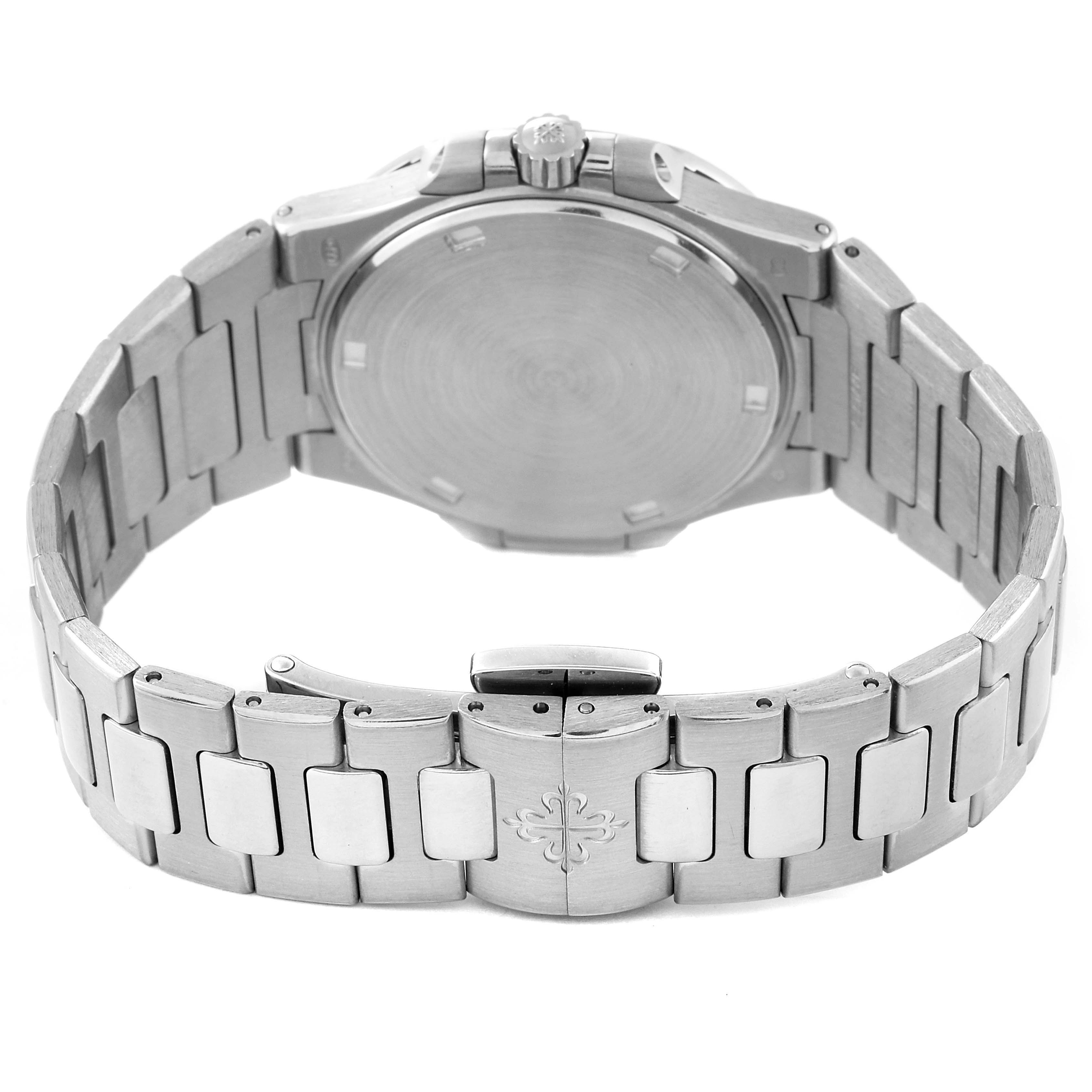 The image shows the back and bracelet of a Patek Philippe Nautilus 7011/1G-001 Women's White Gold Silver Dial 7011/1G-001 Women's White Gold Silver Dial watch, including the clasp and crown.