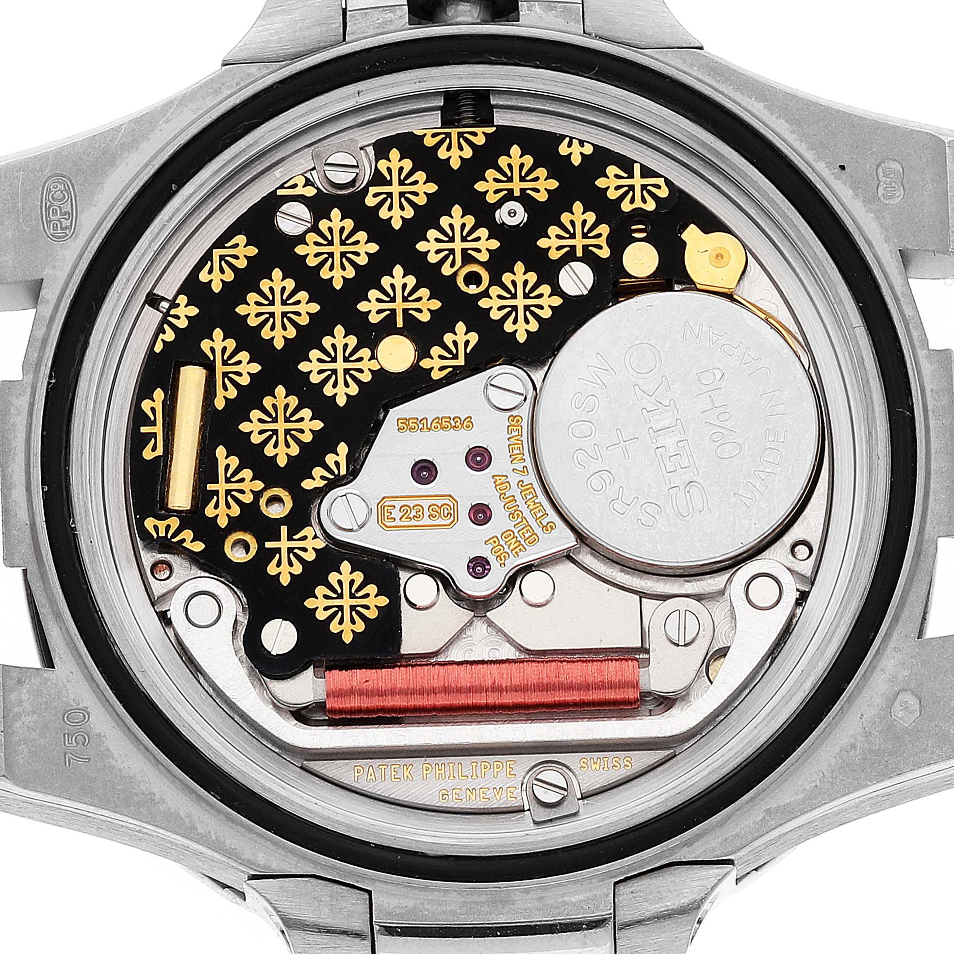 This image shows a close-up of the movement mechanism of a Patek Philippe Nautilus 7011/1G-001 Women's White Gold Silver Dial 7011/1G-001 Women's White Gold Silver Dial watch from the back.