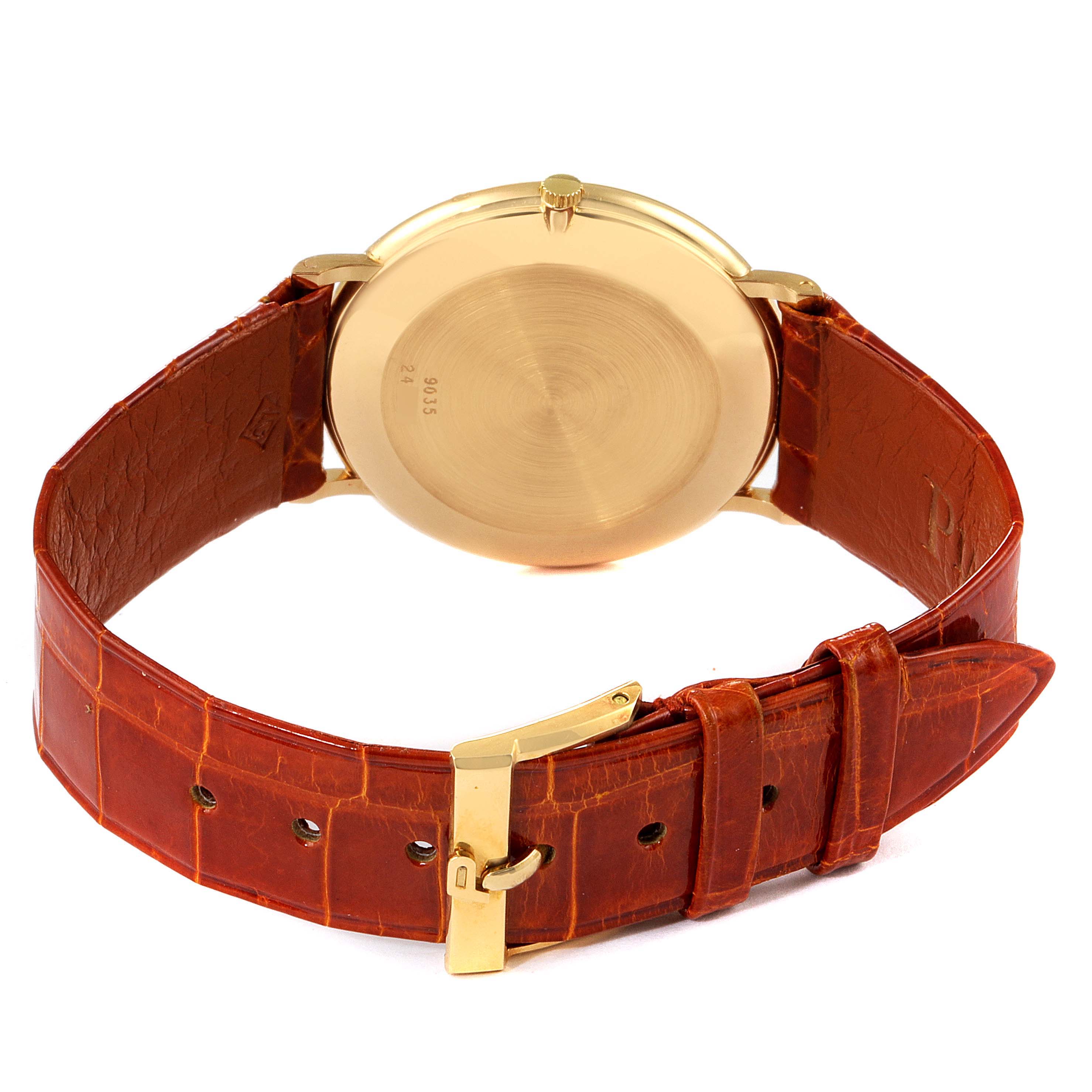 The image shows the back case and leather strap of a Piaget 9035 Men
s Yellow Gold Green Dial 9035 Men
s Yellow Gold Green Dial Yellow Gold Malachite Stone Dial Vintage Men
s Watch 9035 model.