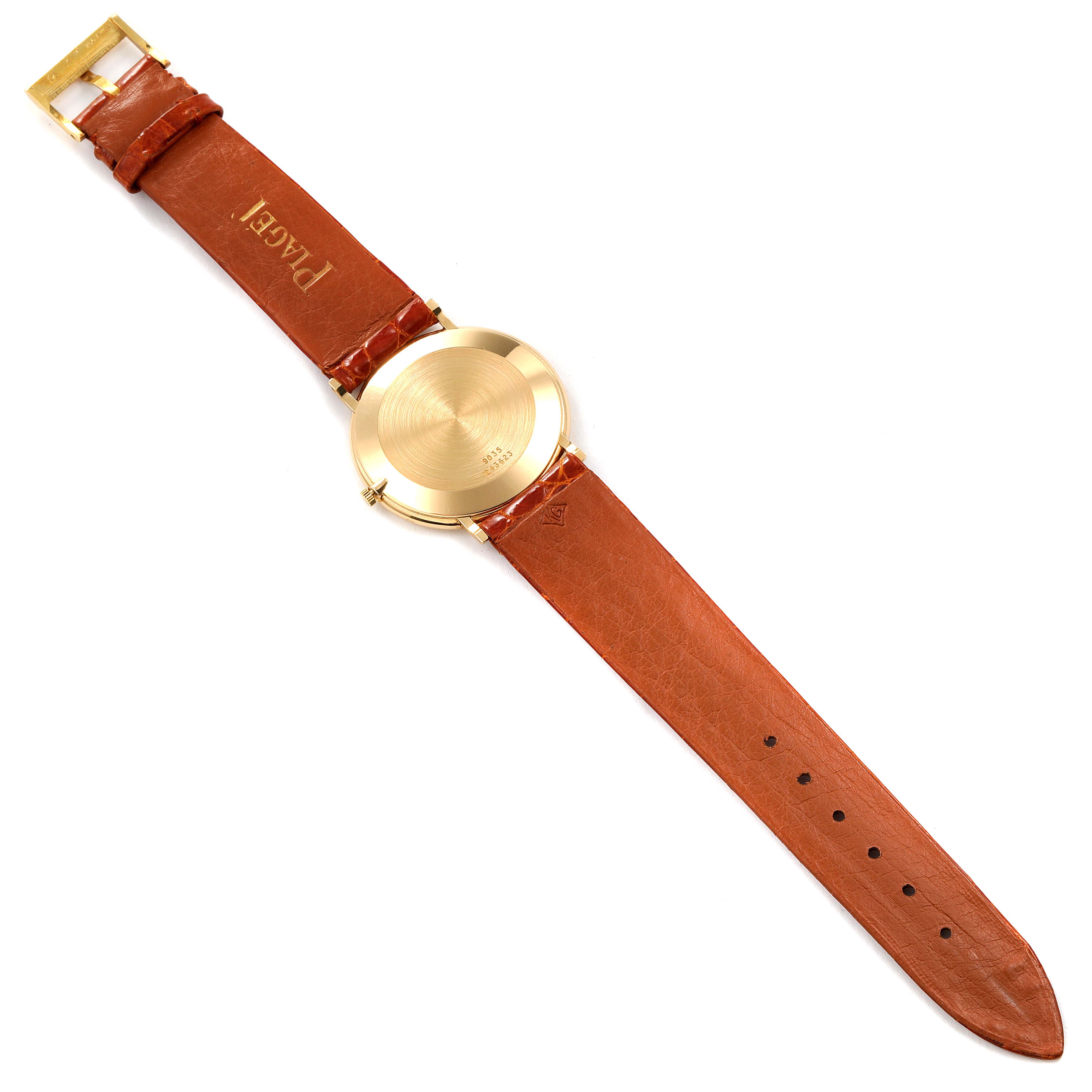 The image shows the back view of a Piaget 9035 Men
s Yellow Gold Green Dial 9035 Men
s Yellow Gold Green Dial Yellow Gold Malachite Stone Dial Vintage Men
s Watch 9035, highlighting the strap and case back.