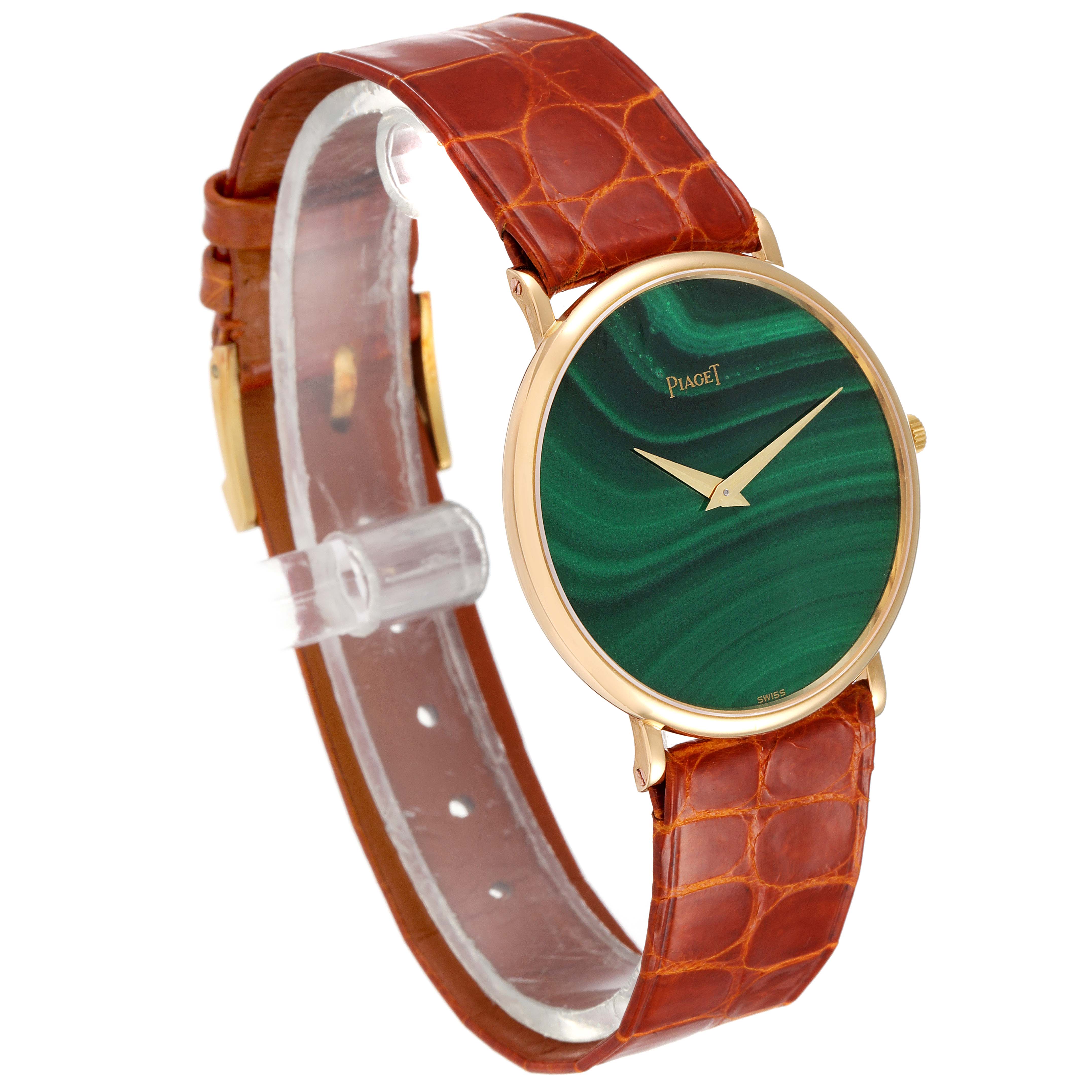 The Piaget 9035 Men
s Yellow Gold Green Dial 9035 Men
s Yellow Gold Green Dial 9035 Yellow Gold Malachite Stone Dial Vintage Men
s Watch is shown at a slight angle, highlighting the dial and band.
