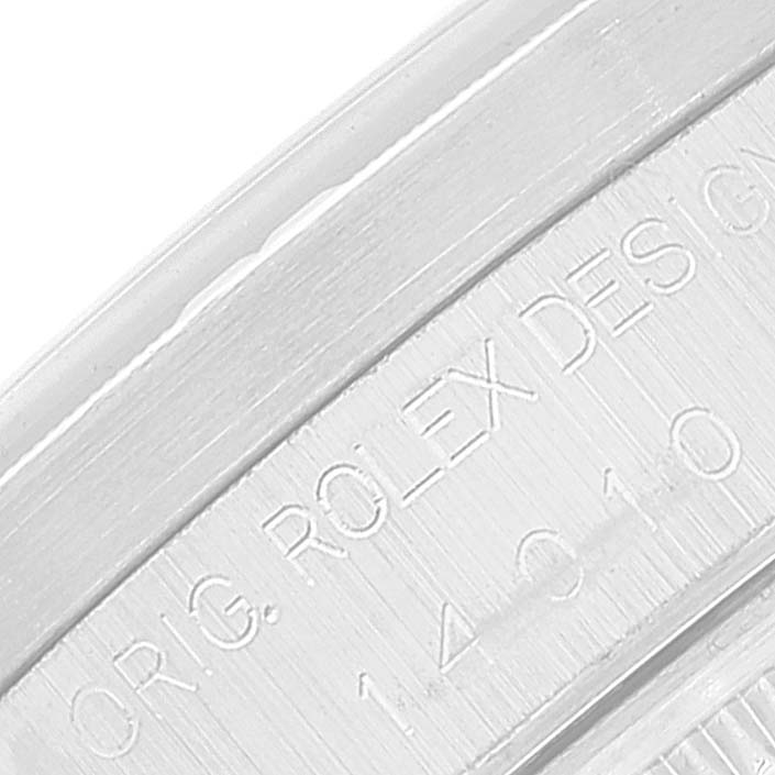 The image shows a close-up of the engraved side of the bezel of a Rolex Air-King 14010 Men's Stainless Steel Black Dial 14010 Men's Stainless Steel Black Dial watch.