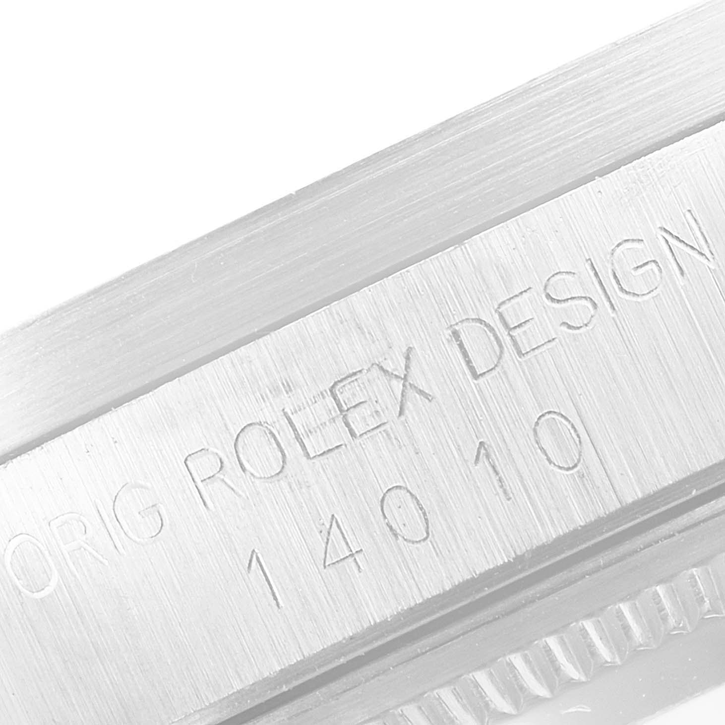 The image shows a close-up of the engraved bezel of a Rolex Air-King 14010 Men's Stainless Steel Blue Dial 14010 Men's Stainless Steel Blue Dial watch.