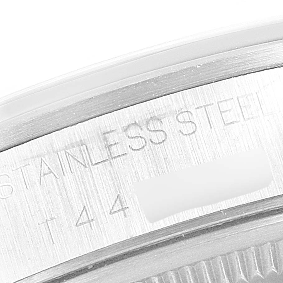 This close-up image shows the case back and part of the lettering on a Rolex Air-King 14000 Men's Stainless Steel Silver Dial 14000 Men's Stainless Steel Silver Dial watch.