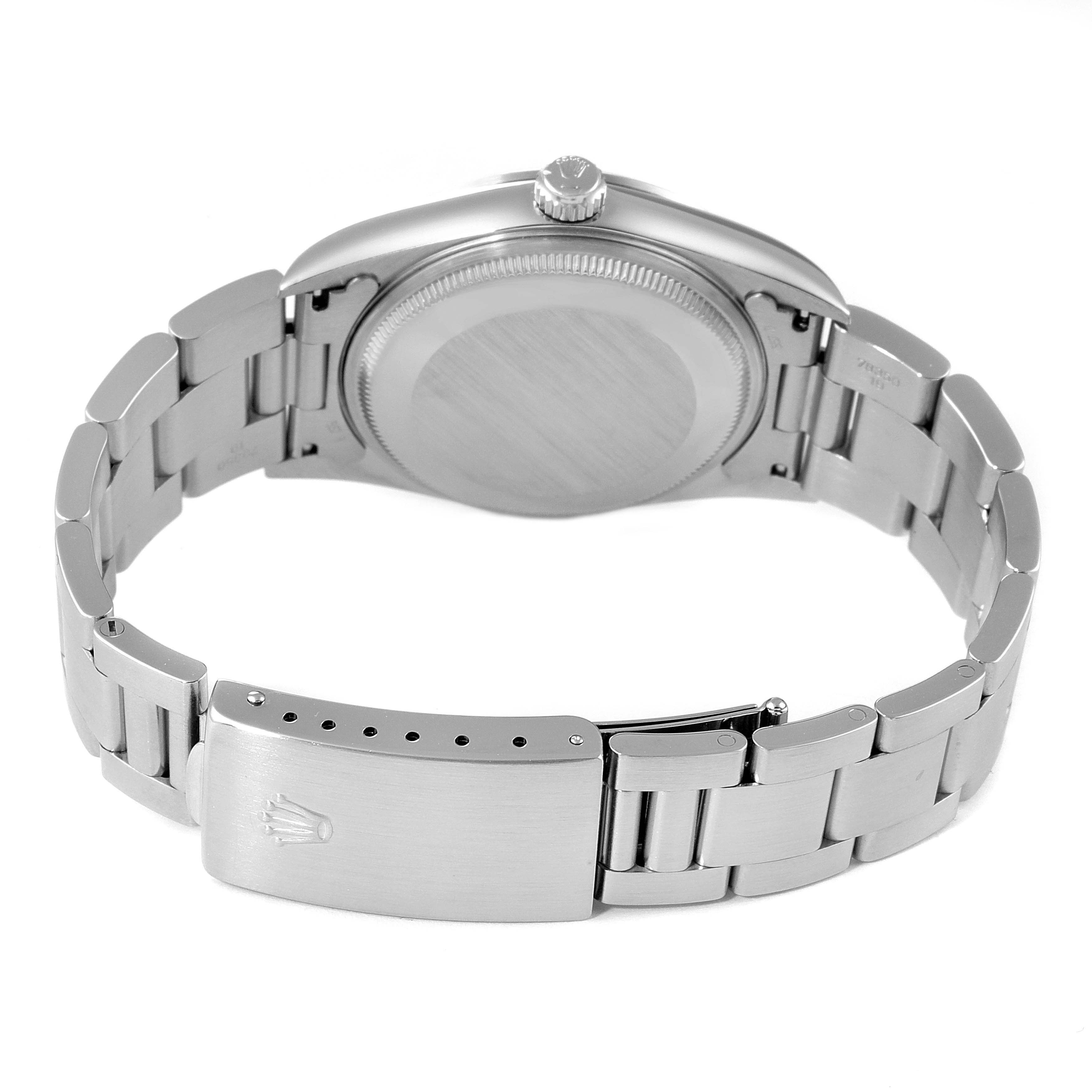 This image shows the backside of the Rolex Air-King 14000 Men's Stainless Steel Silver Dial 14000 Men's Stainless Steel Silver Dial watch, focusing on the case back and the bracelet with the clasp open.